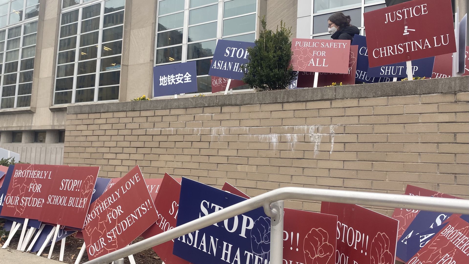 Supporters of Christina Lu leave signs at the School District of Philadelphia headquarters. Photo. Taylor Allen/Axios