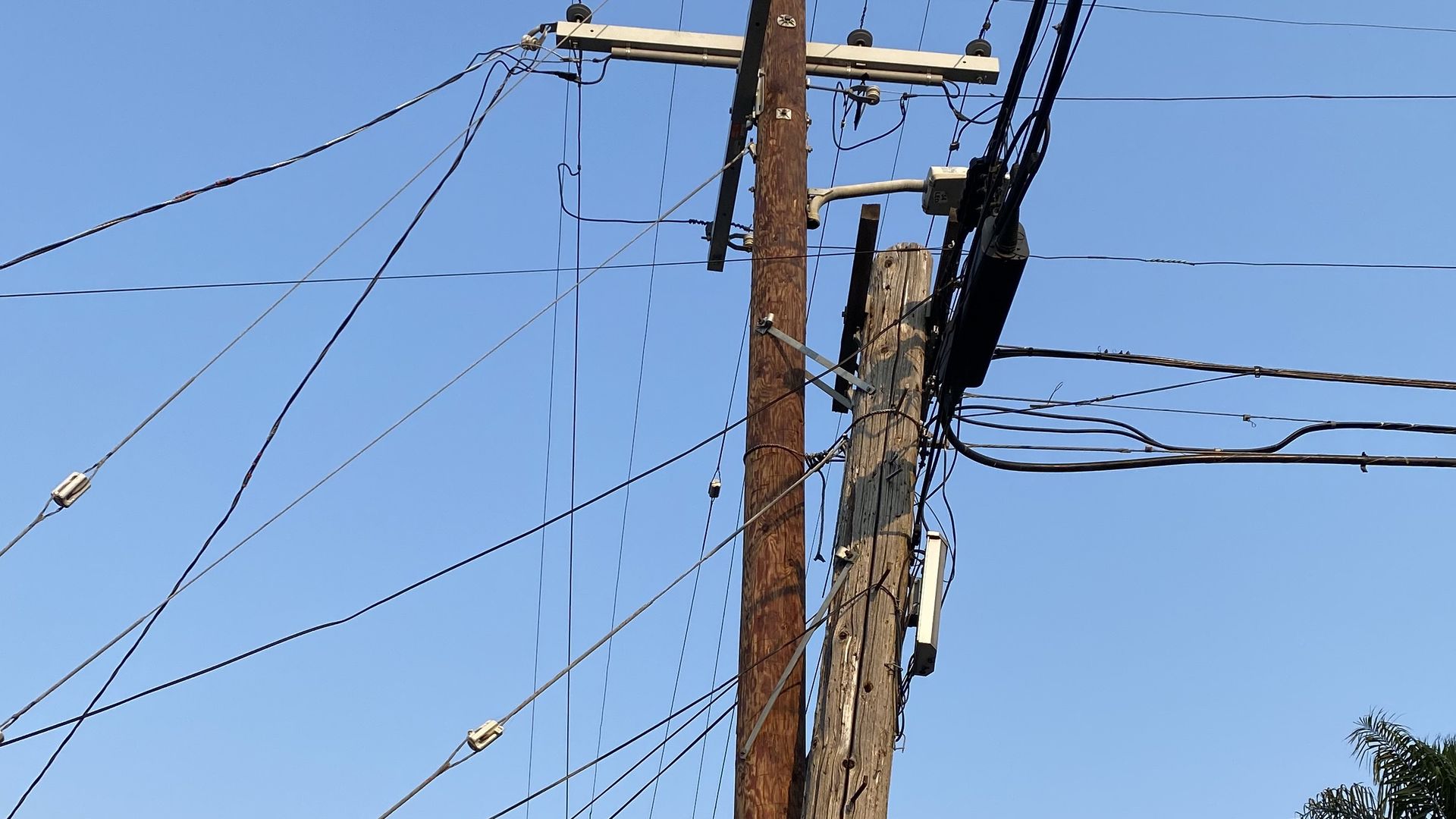 A utility pole cluttered with 
