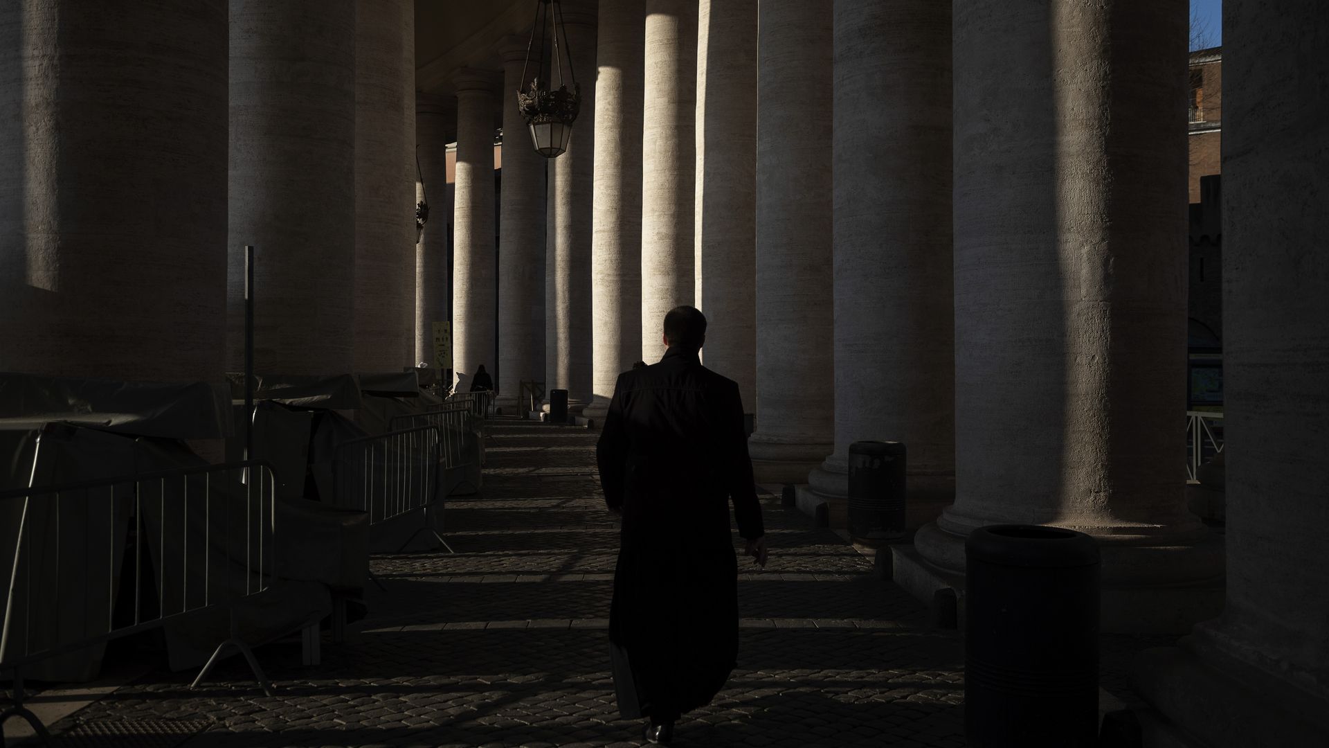 Priest walking in Vatican