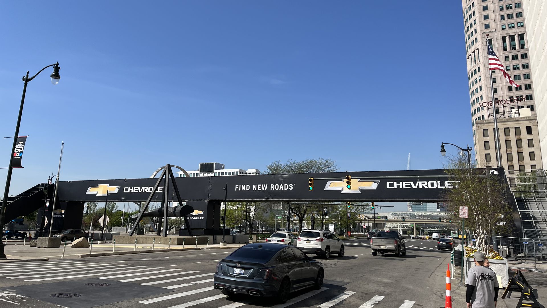 Cars on Jefferson pass under a temporary bridge for the 2023 Grand Prix