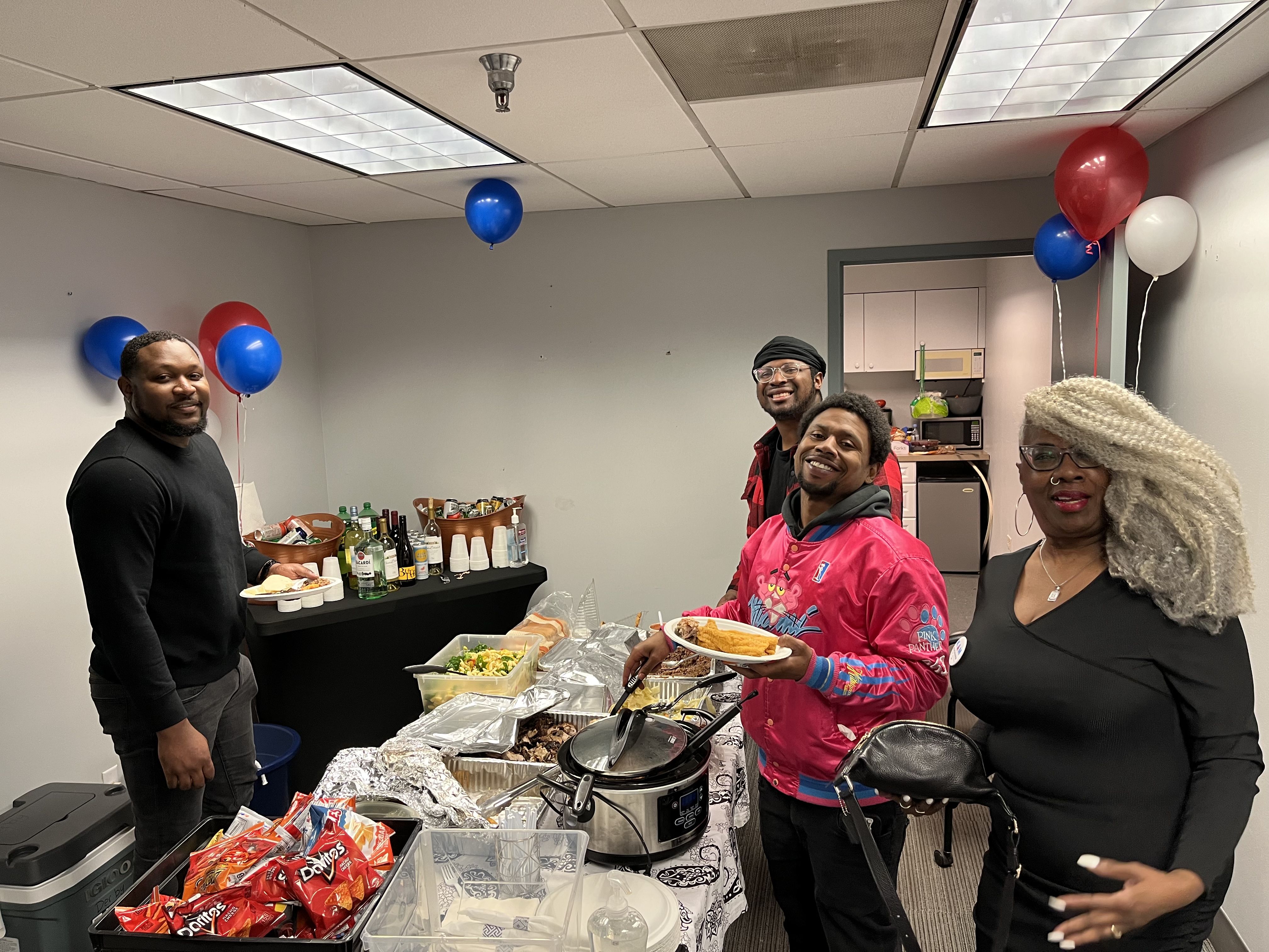 Photo of people at a potluck
