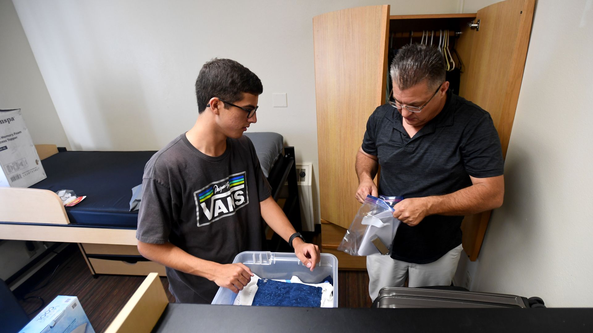 A college student unpacking.