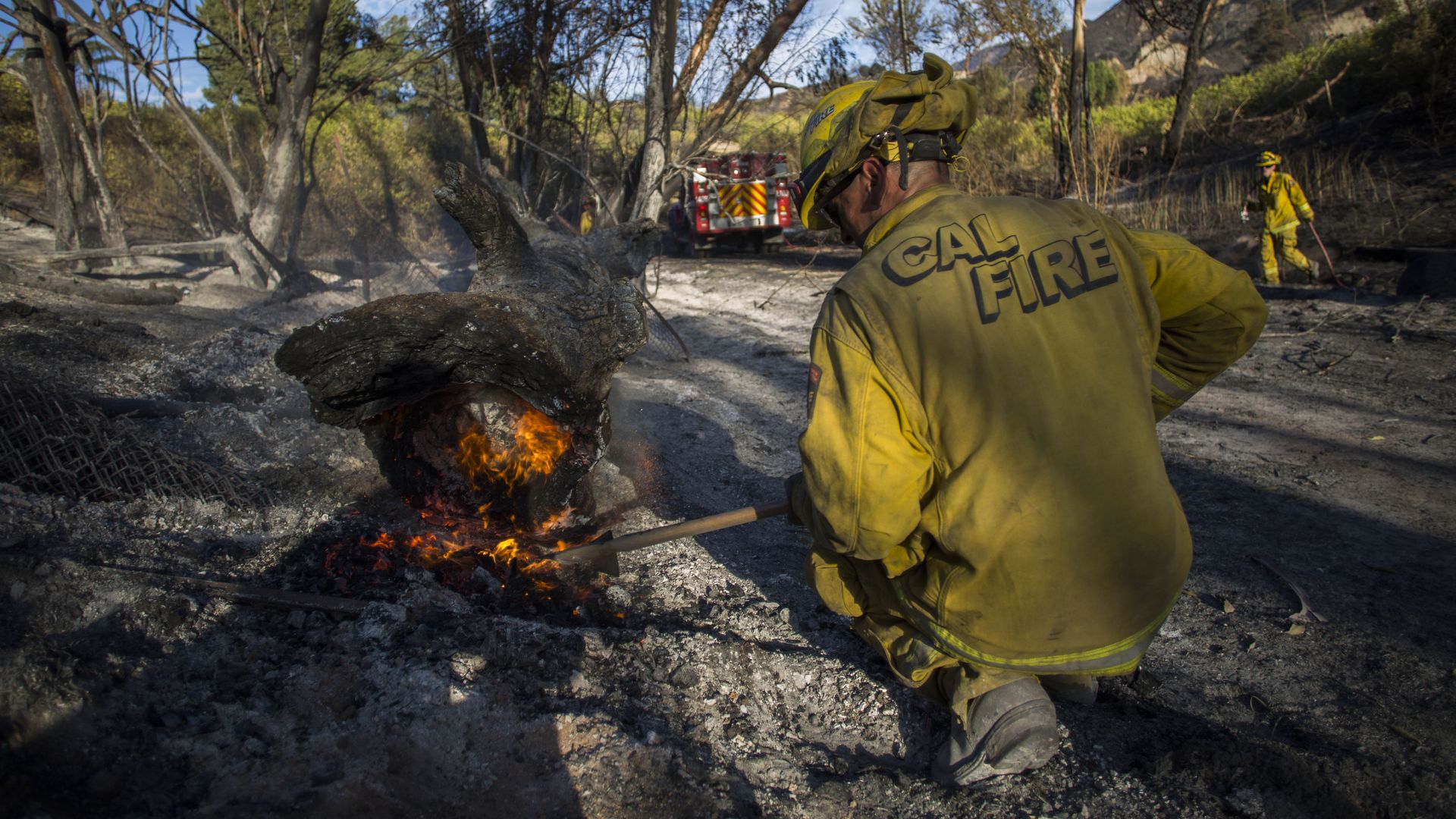 A firefighter controls a hotspot of the Maria Fire, in Santa Paula, Ventura County, California