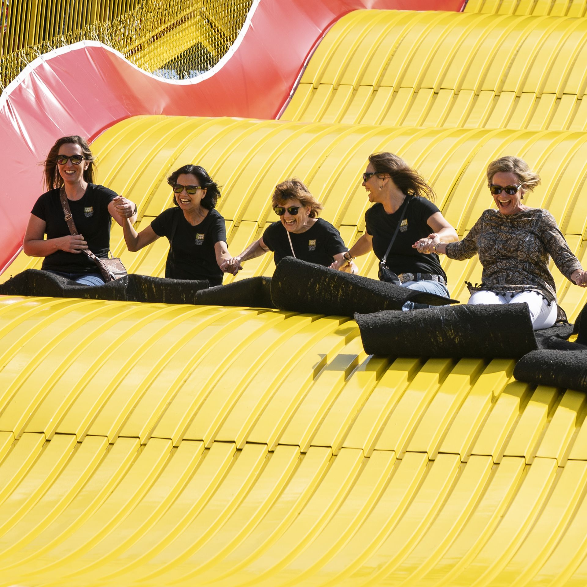 A group of ladies ride the Giant Slide together at the Minnesota State Fair 