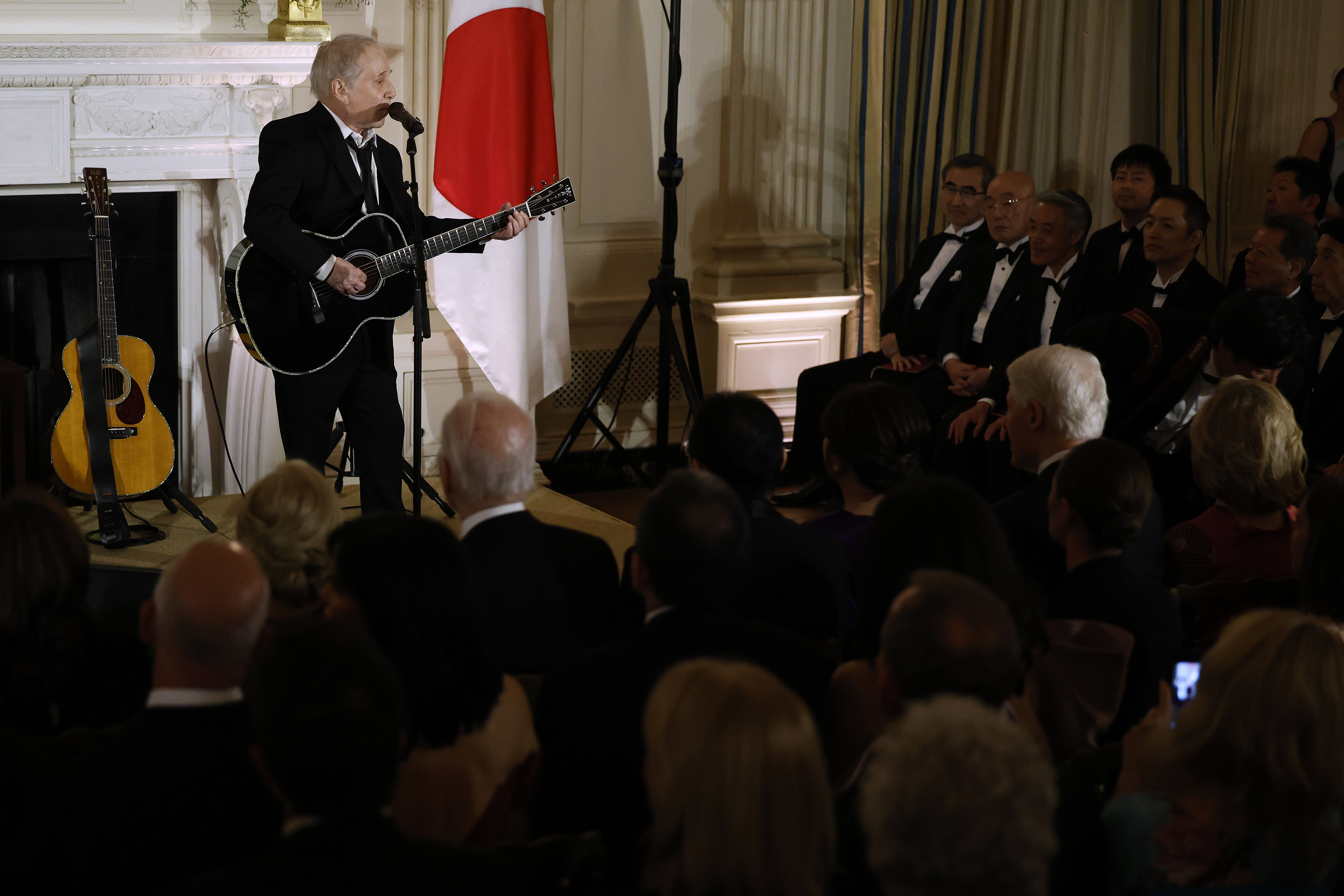 American singer-songwriter Paul Simon performs as U.S. President Joe Biden and first lady Jill Biden host Japanese Prime Minister Fumio Kishida and his wife Yuko Kishida in the East Room of the White House on April 10, 2024 in Washington, DC. Biden welcomed Kishida for an official state visit where the two leaders announced new agreements on technology and strengthening military and economic partnerships against Chinese aggression in the Indo-Pacific region. 