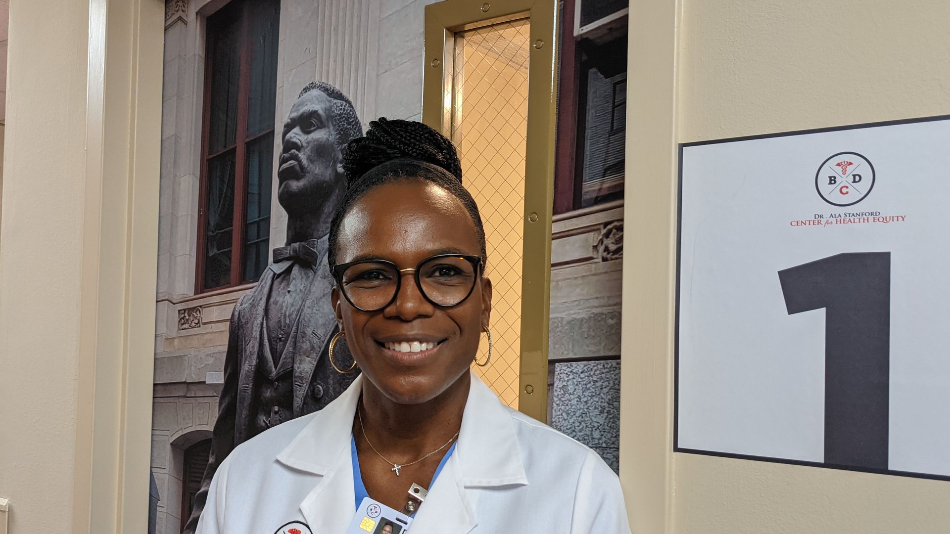 Ala Stanford, a surgeon, stands inside the hallway of her new health center in North Philadelphia.