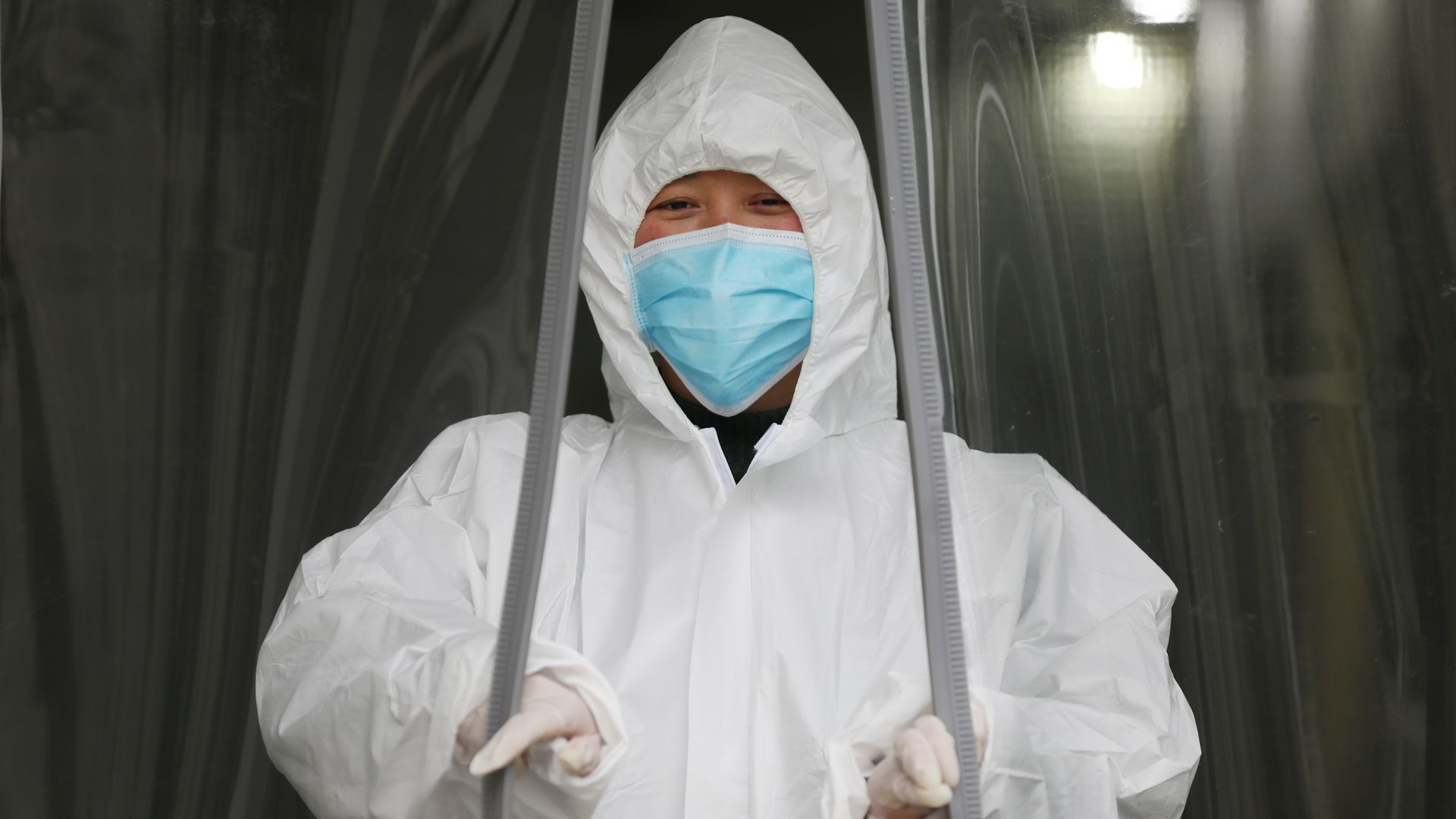 A medical worker walks out of a hospital in Wuhan, China