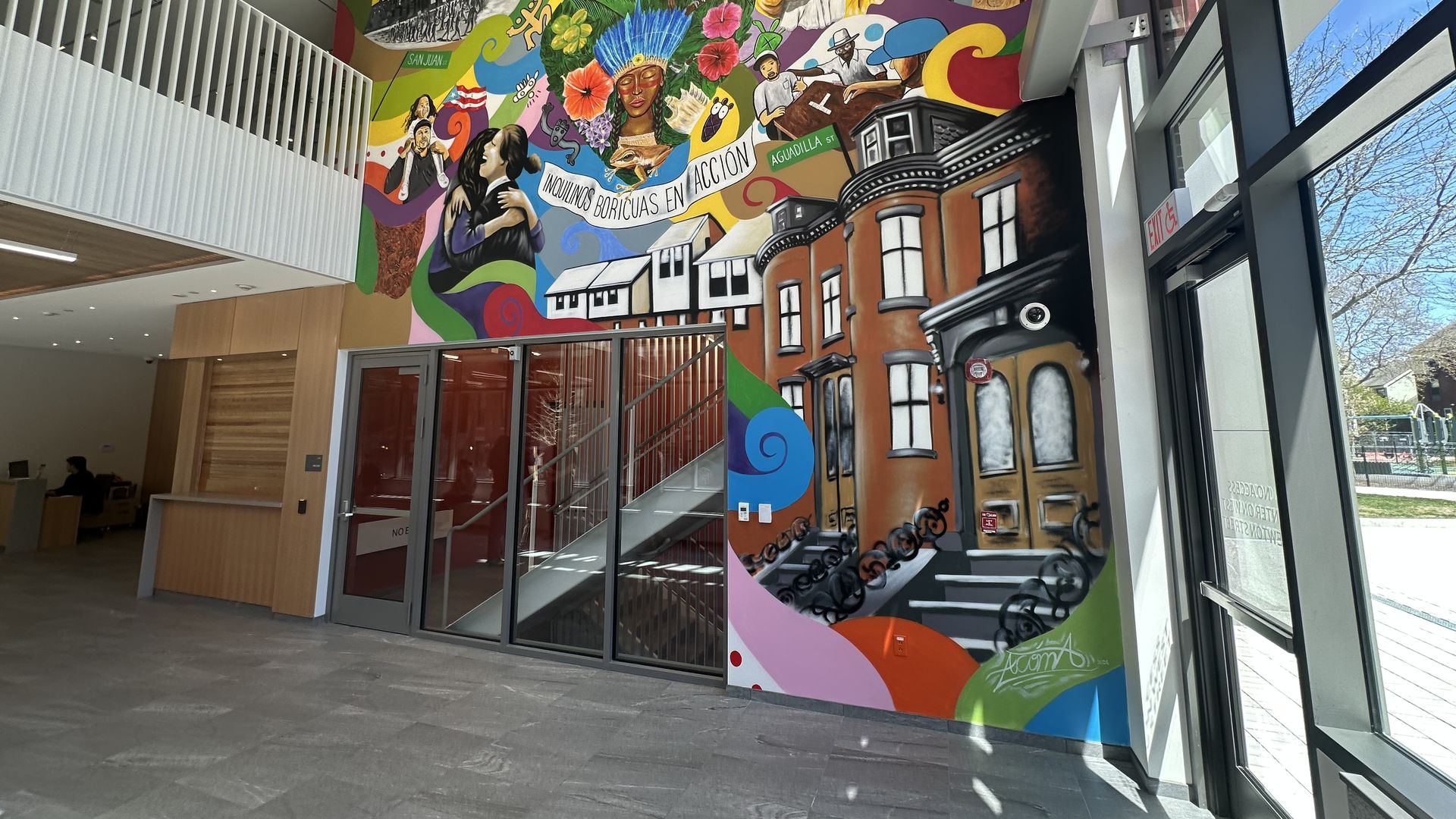 A mural by local Puerto Rican artist Alvin Acóma Colón displays Inquilinos Boricuas en Acción's history right in La CASA's lobby, including South End architecture, musical instruments, residents playing domino and motifs of Taino history and culture. 