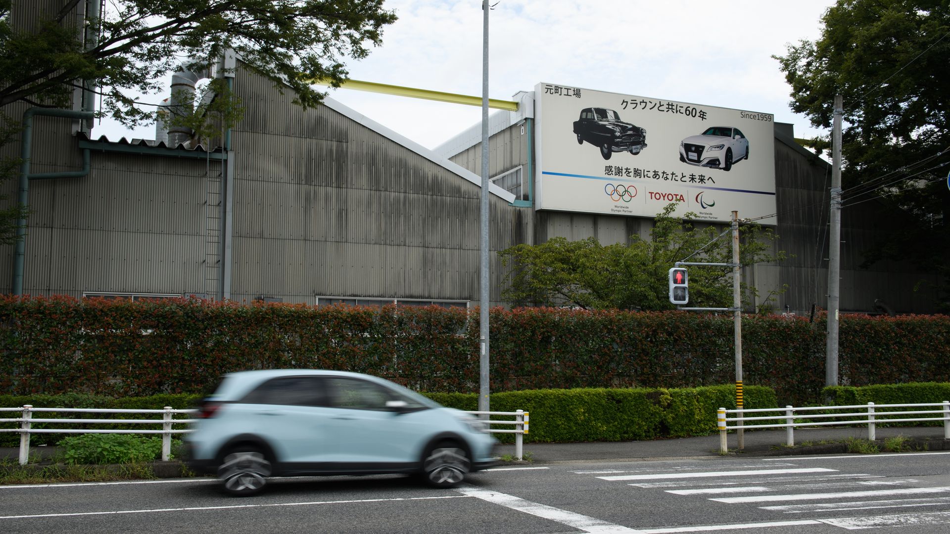 A vehicle drives past the Toyota Motor Corp's Motomachi plant in Toyota, Aichi Prefecture, Japan.