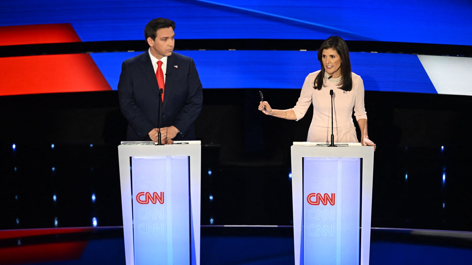 Florida Governor Ron DeSantis (L) and former US Ambassador to the UN Nikki Haley speak during the fifth Republican presidential primary debate at Drake University in Des Moines, Iowa, on January 10, 2024