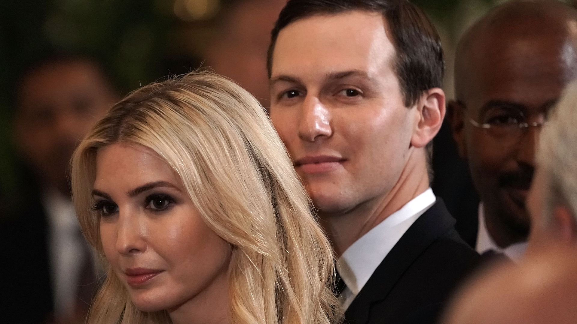 Ivanka Trump and Jared Kushner sitting next to each other at an event