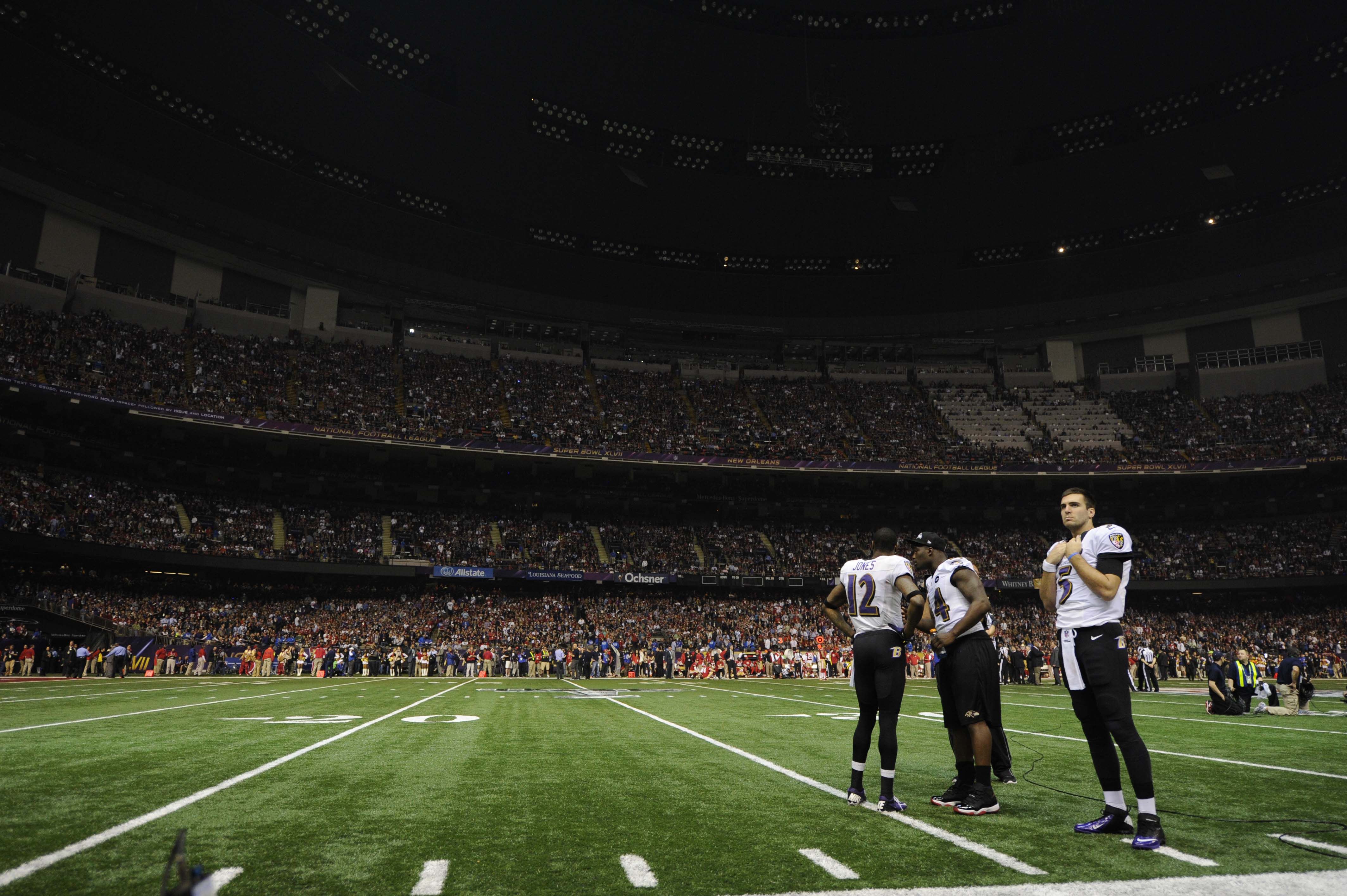 Photo shows Ravens players on the field.