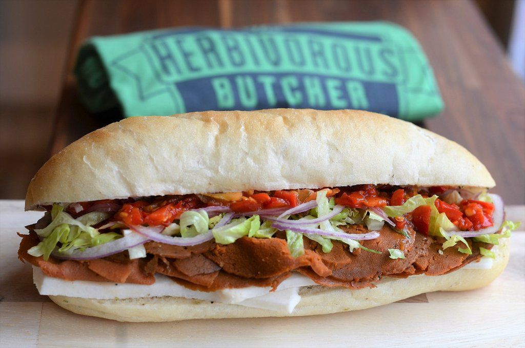big sandwich on table using vegan ingredients