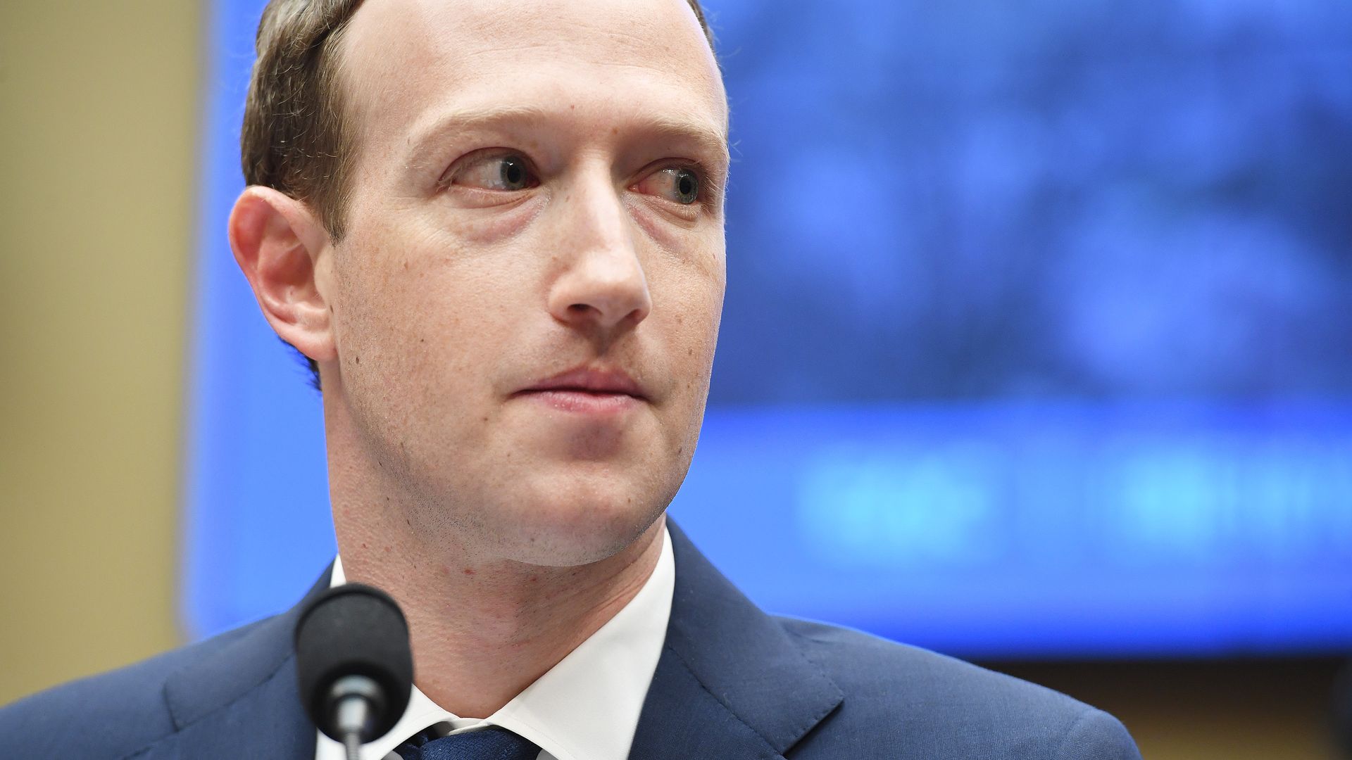 A close-up shot of Facebook's Mark Zuckerberg wearing a suit