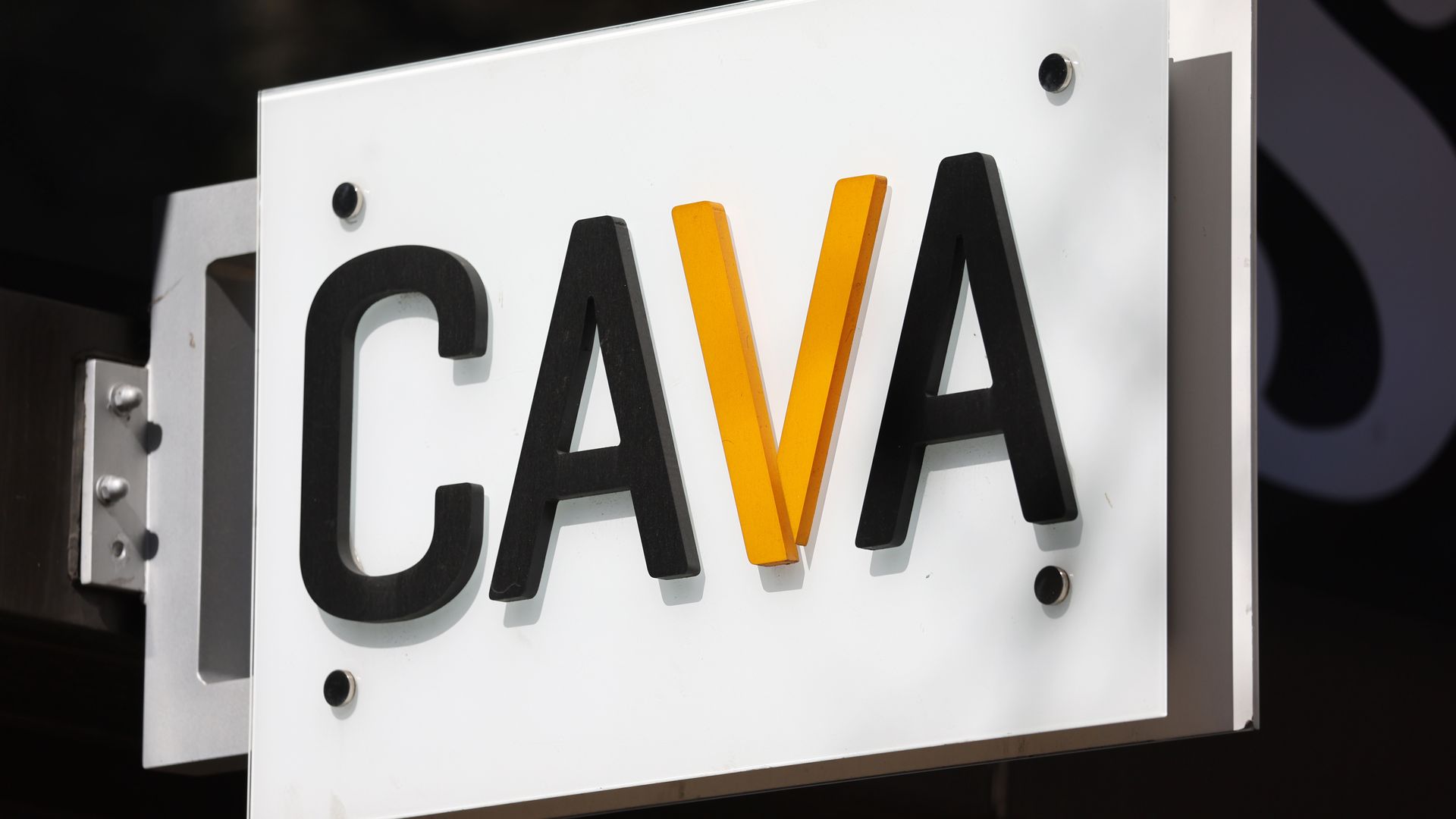 A Cava restaurant sign hangs on one of its locations.