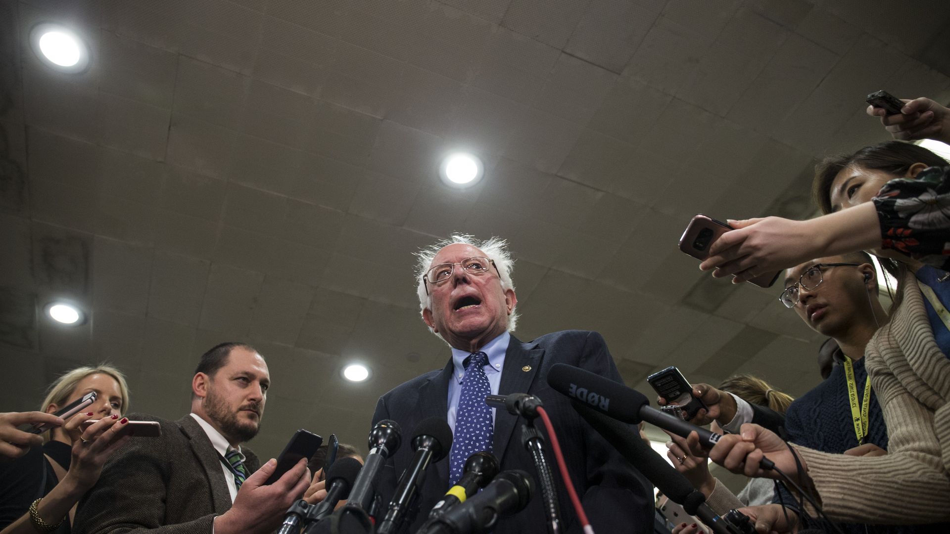 Bernie Sanders speaking to reporters.