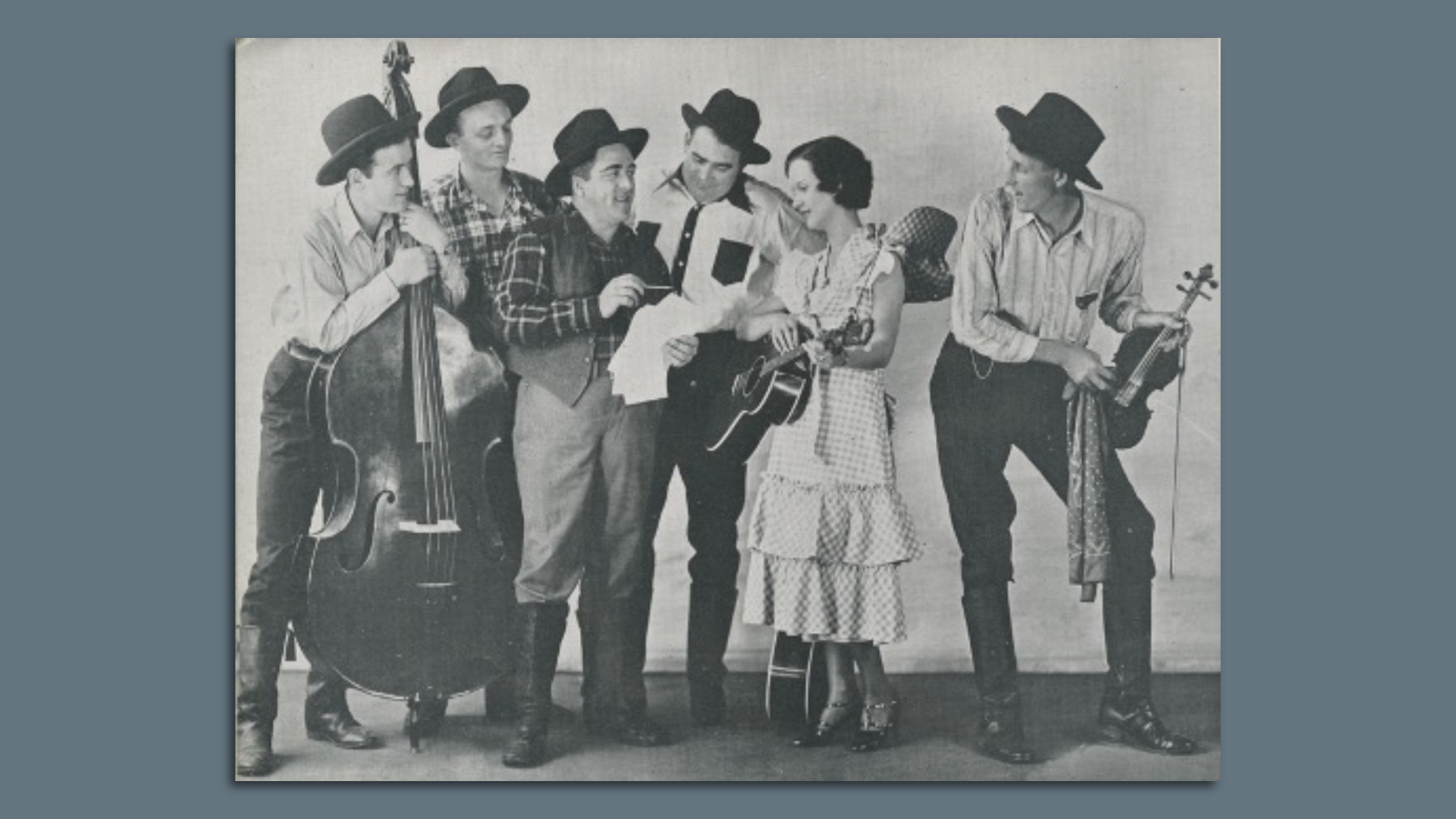 A band plays in a black-and-white photo.