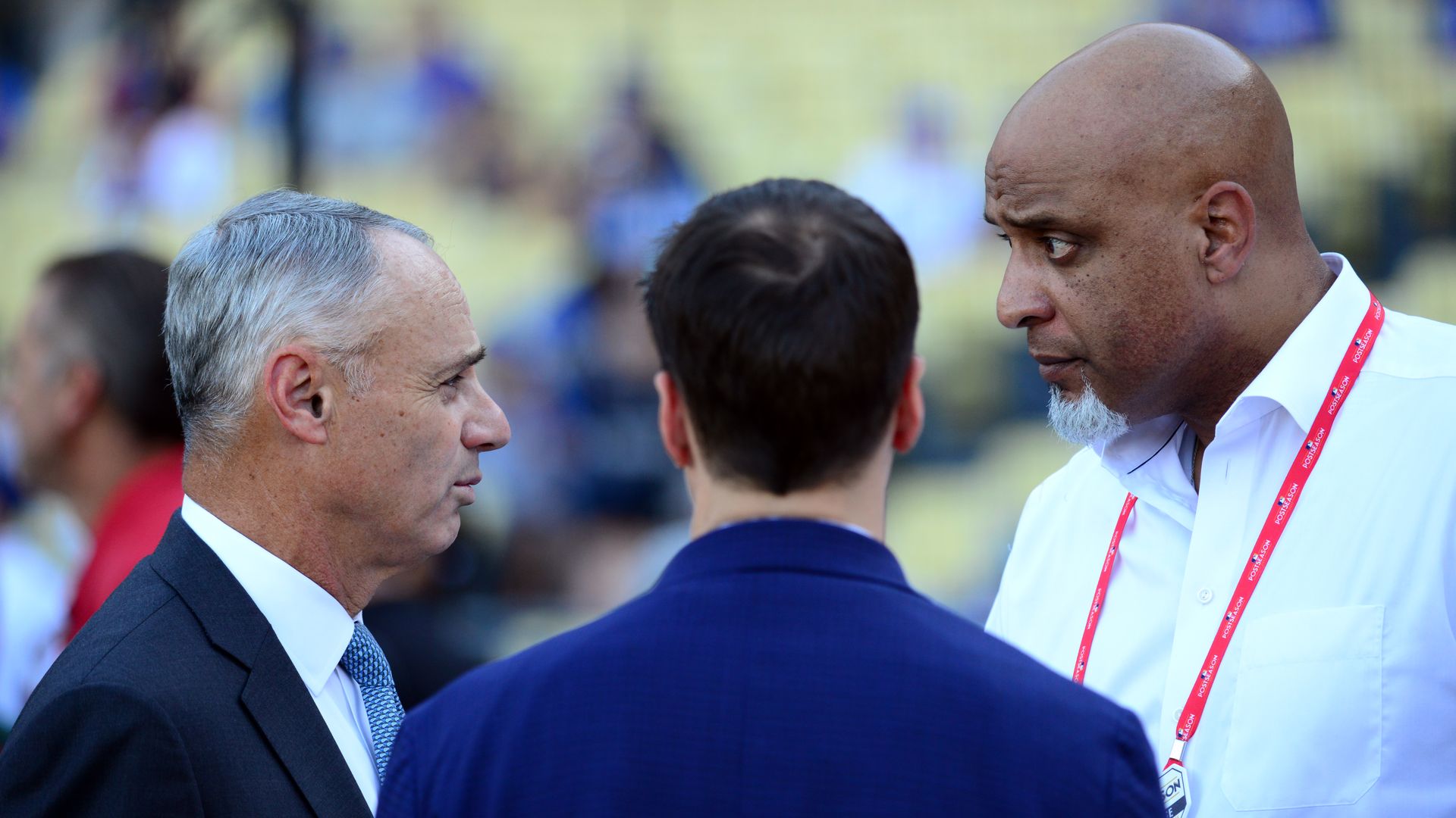 Rob Manfred talking to Tony Clark
