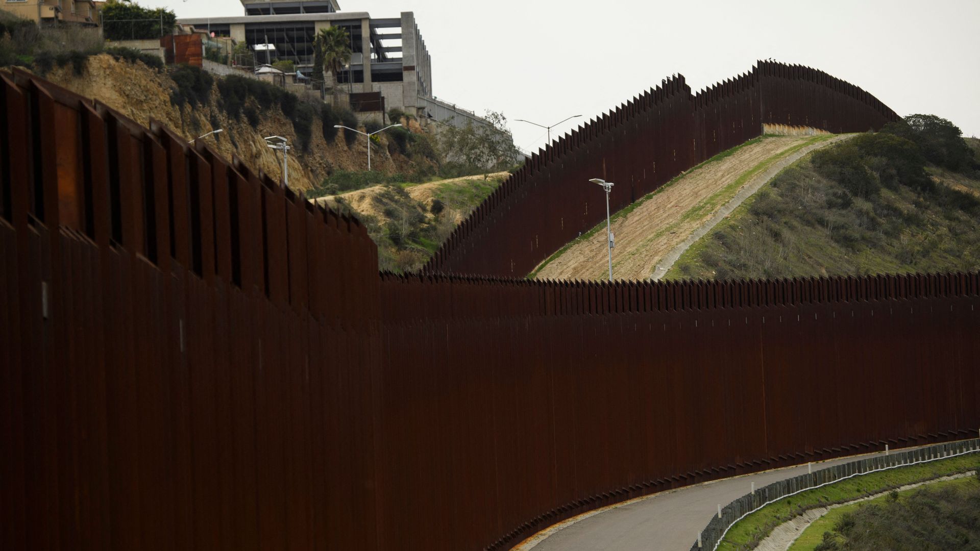 A section of the US-Mexico border wall between San Diego (R) and Tijuana (L) on January 12, 2022 in San Diego County, California.