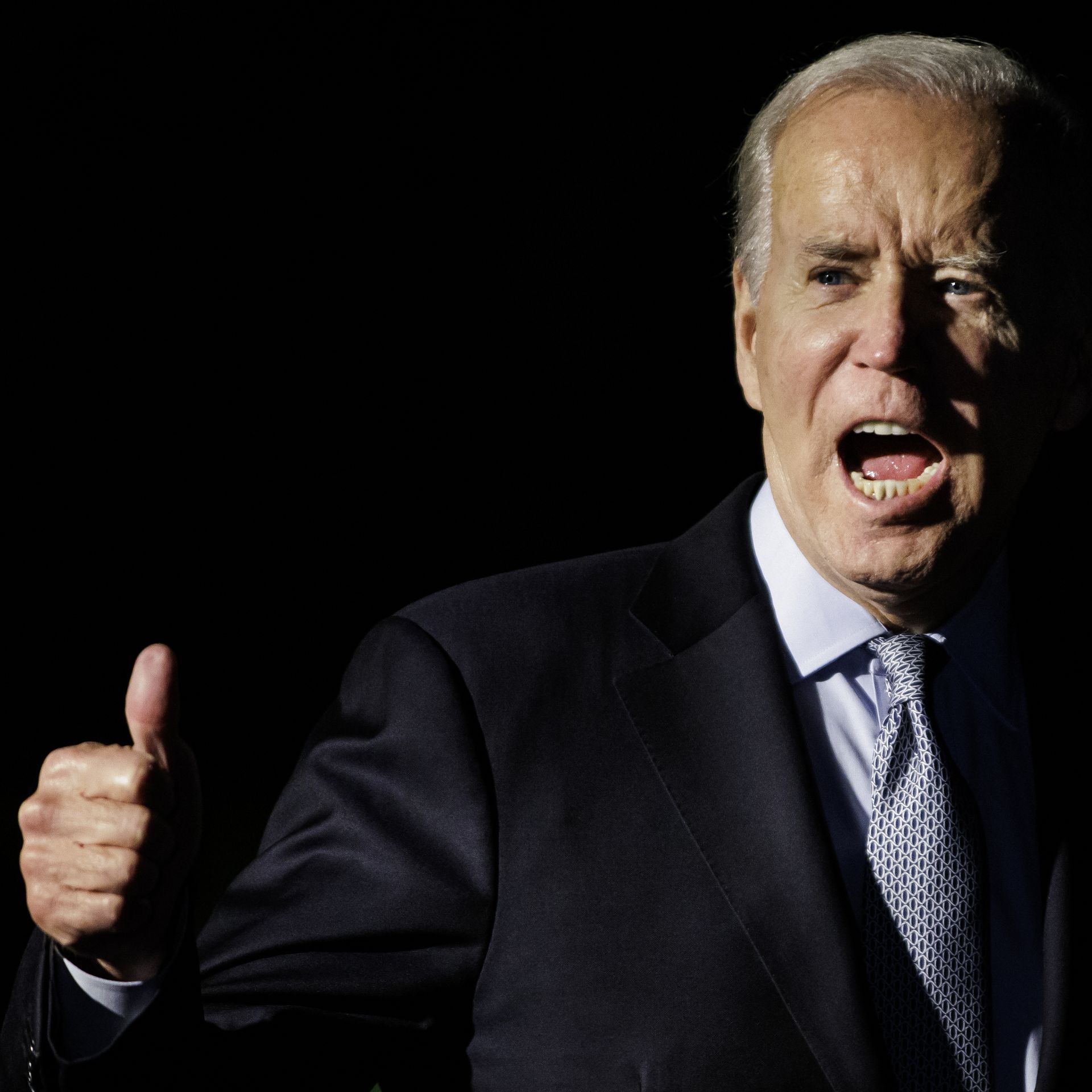 President Biden gives a yell and thumbs up 