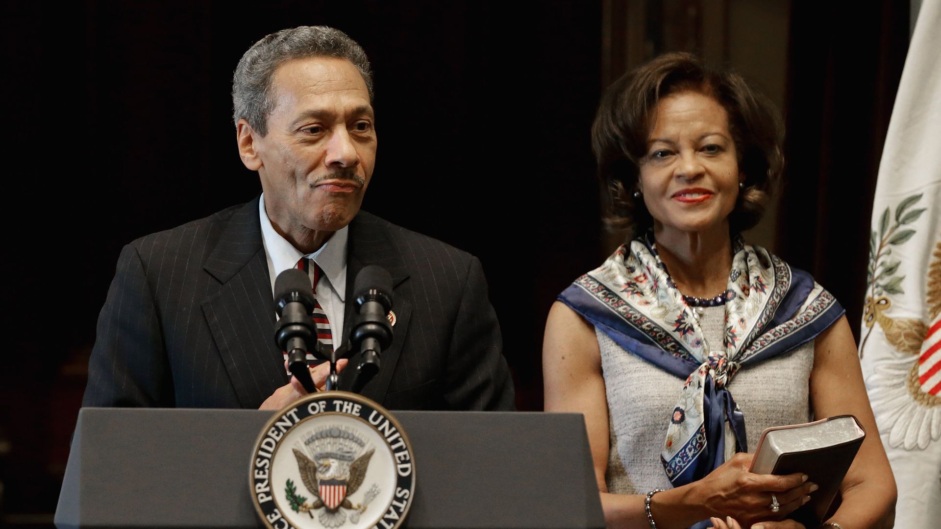 Federal Housing Finance Agency Director Mel Watt  delivers remarks after being sworn. His wife Eulada Watt  stands by his side.