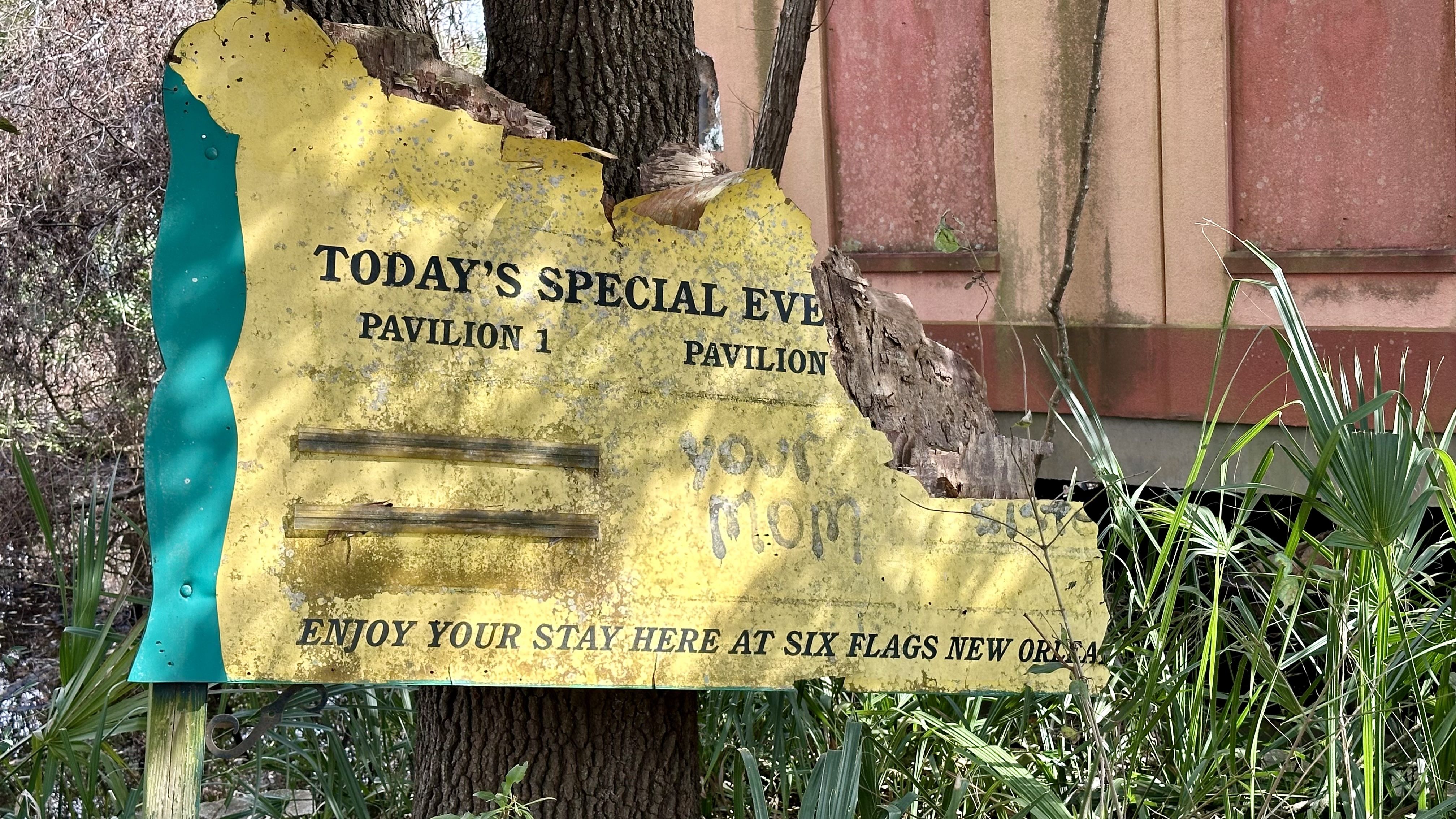 Photo shows a sign that says "enjoy your stay her at Six Flags New Orleans."