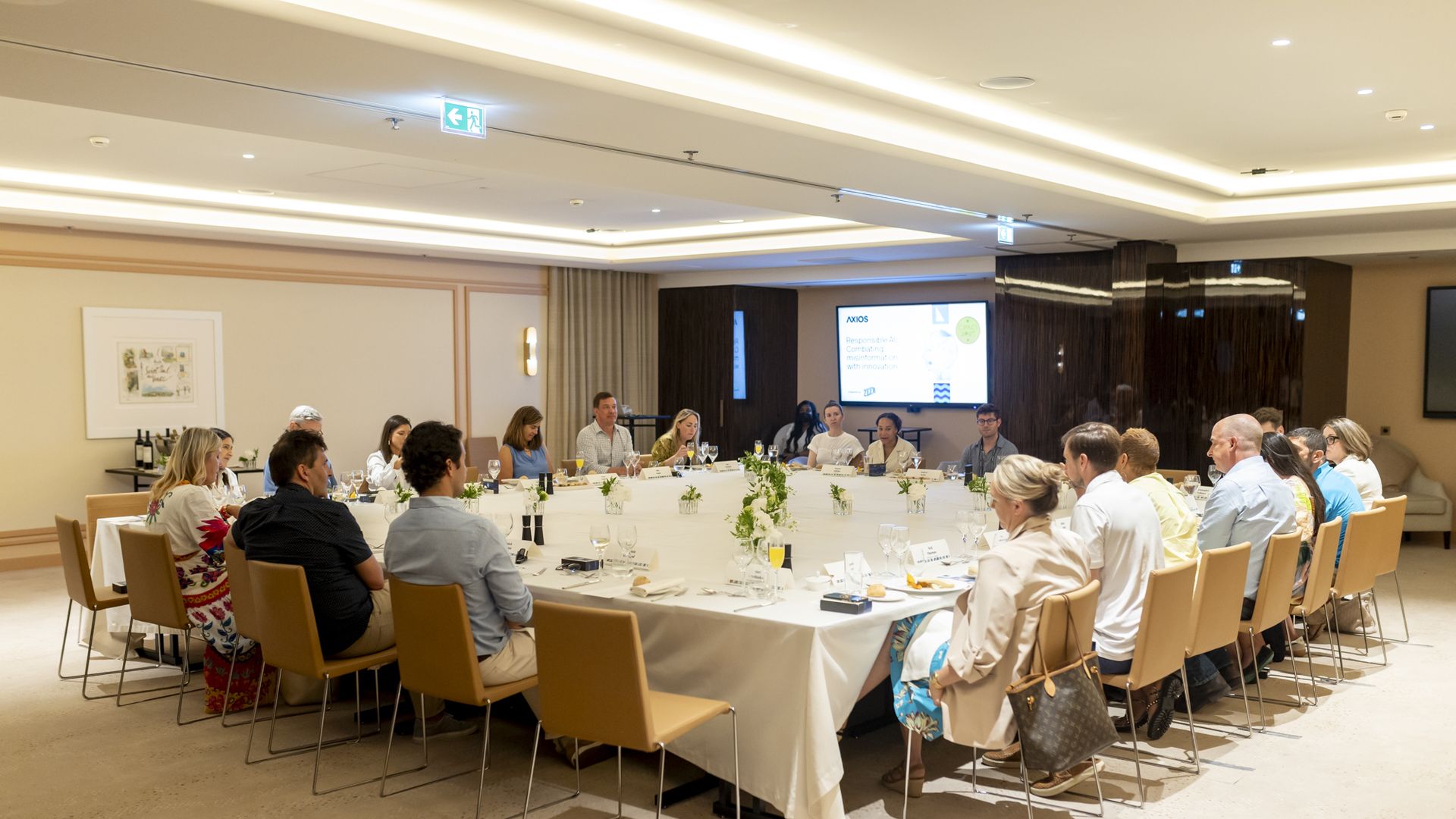 Attendees enjoyed breakfast during the discussion.