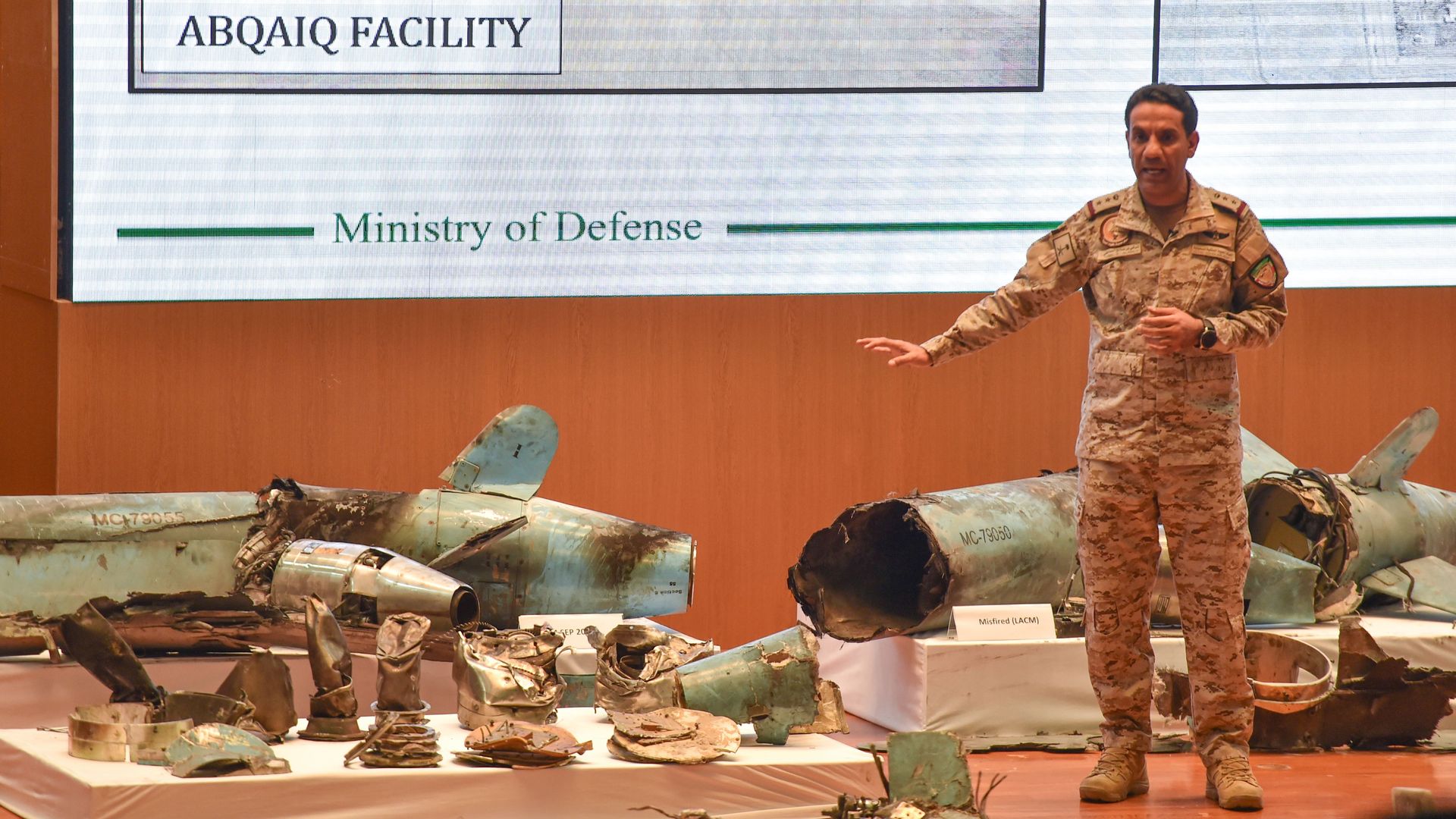 Saudi defense minister on stage with weapons remnants from the weekend's attack on its oil facilities
