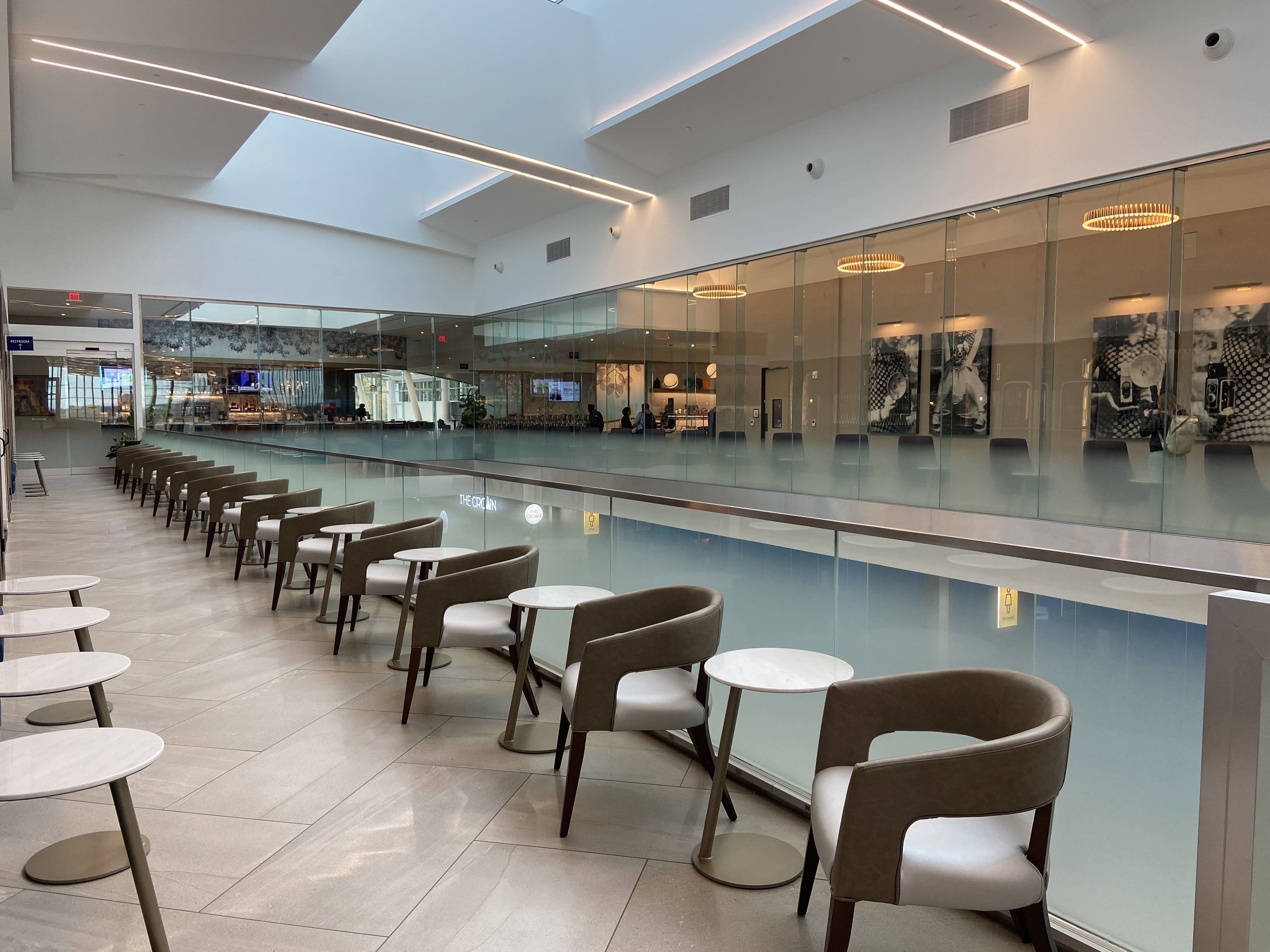 Delta Sky Club overlooking the first level of Concourse A at CLT. 