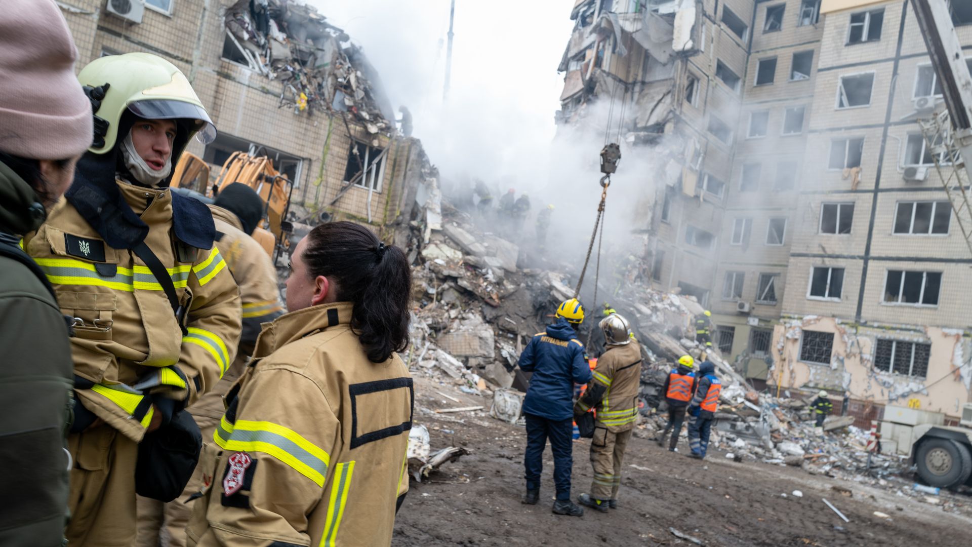 Emergency workers on Jan. 15 searching for survivors of a Russian missile attack on an apartment building in Dnipro, Ukraine.