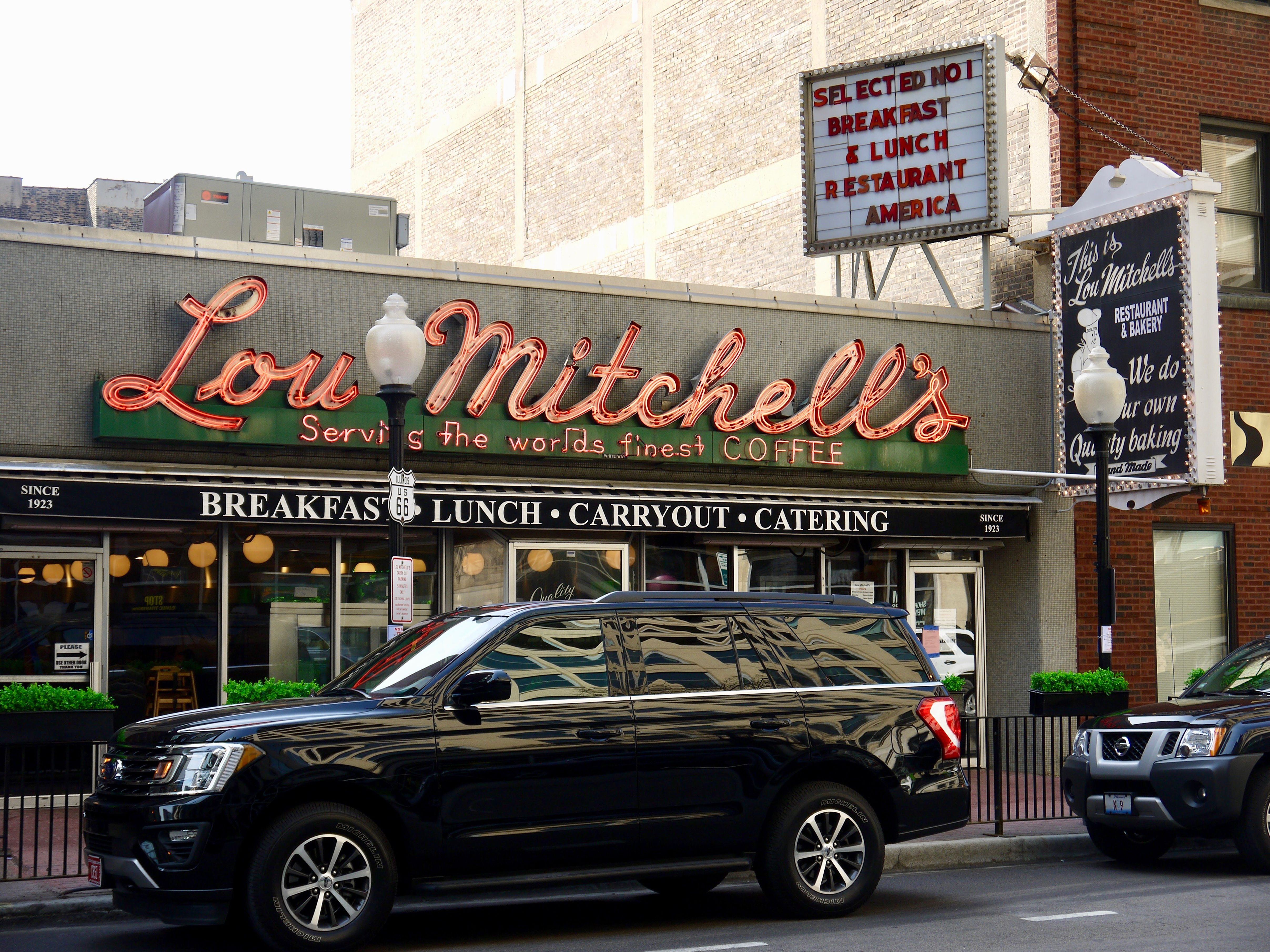 Photo of a restaurant sign that says "Lou Mitchell's" 