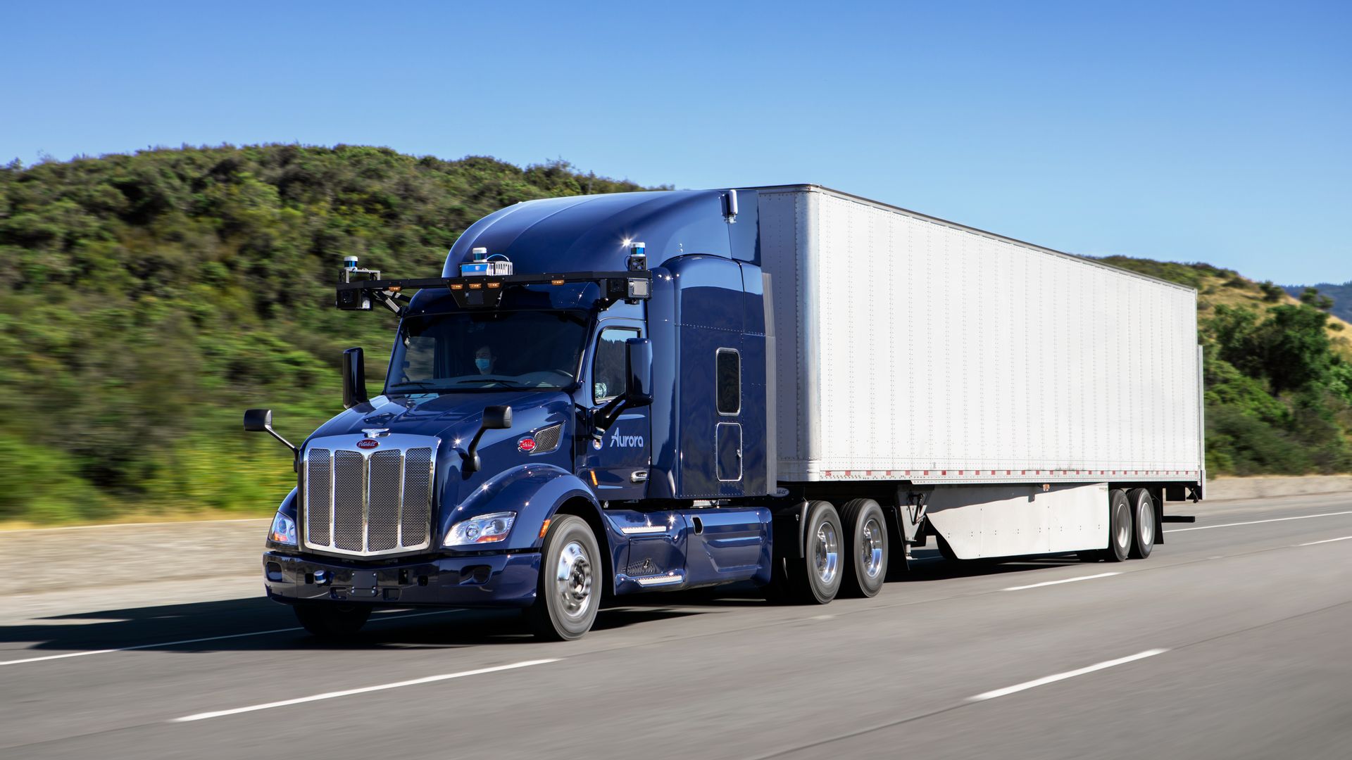 Image of a PACCAR semi-truck equipped with Aurora's self-driving technology.