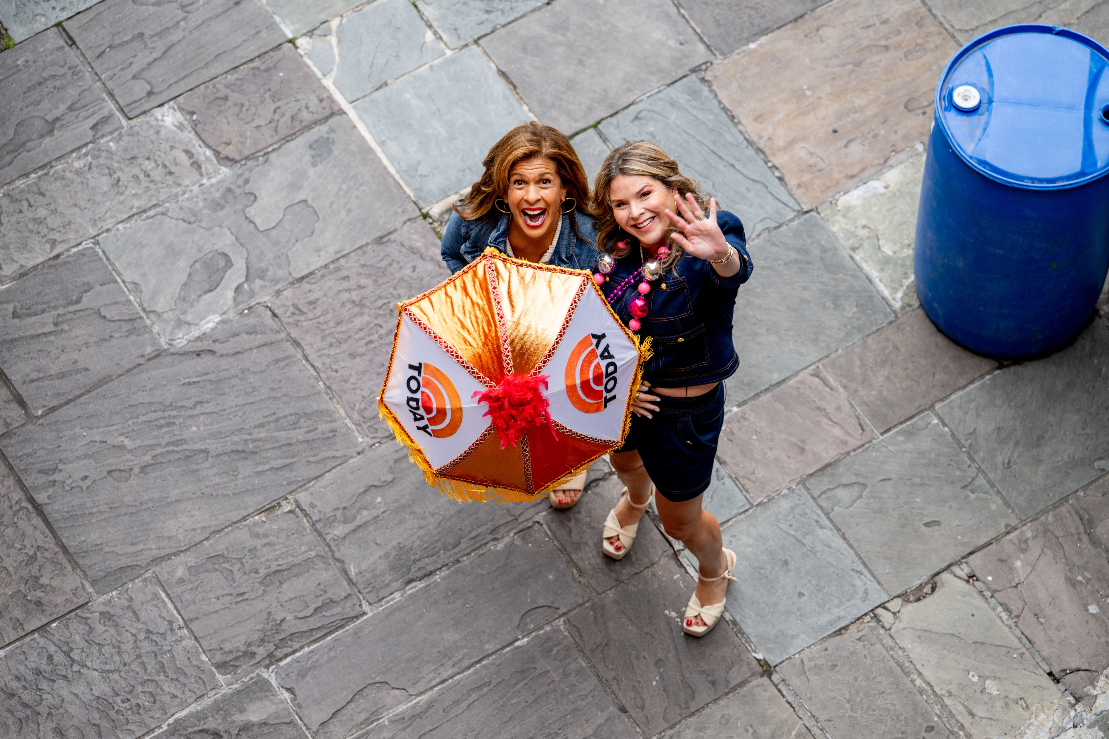 Photo shows Hoda and Jenna with a decorated second-line umbrella