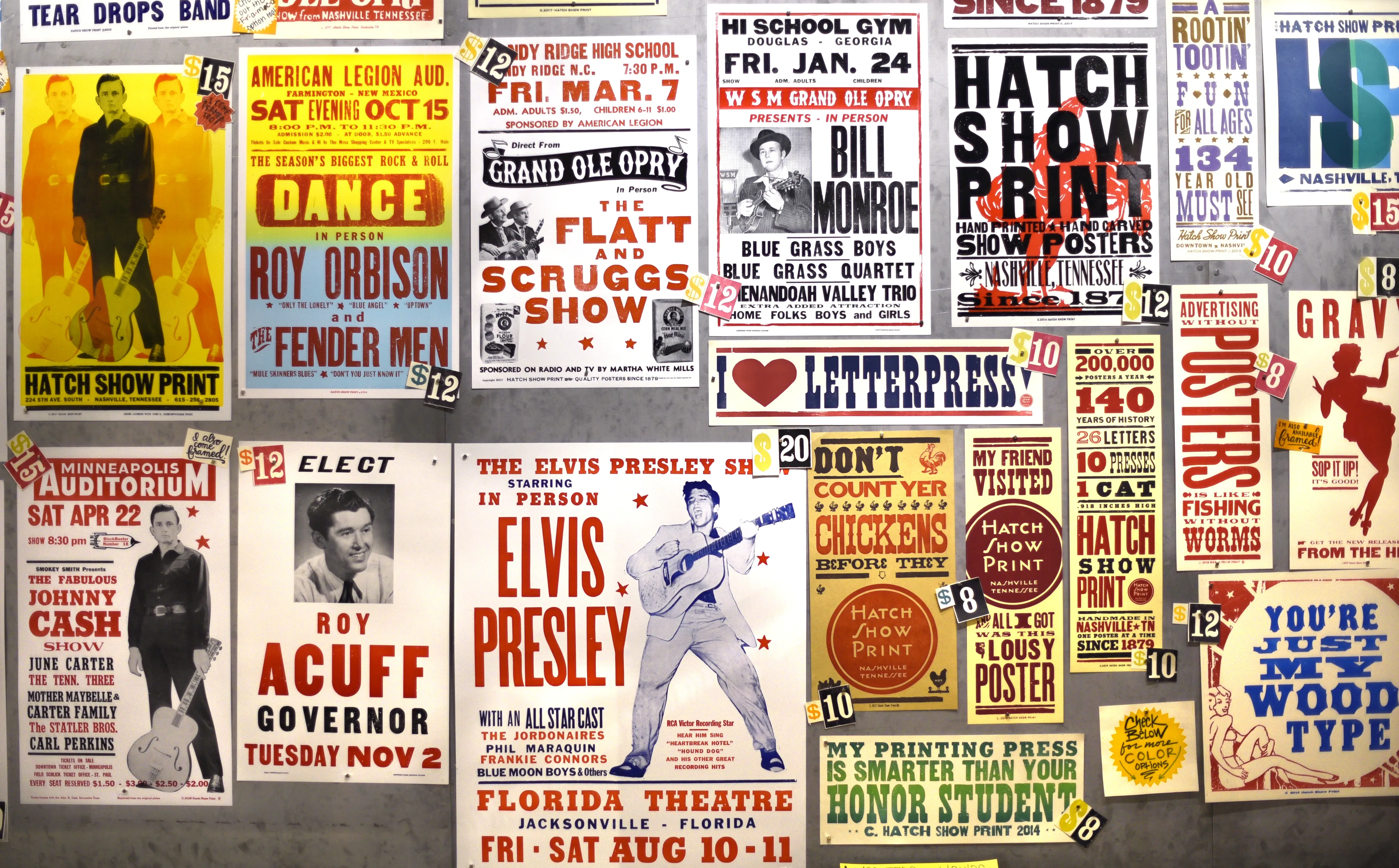 A wall of concert posters advertising Elvis, Johnny Cash and others.