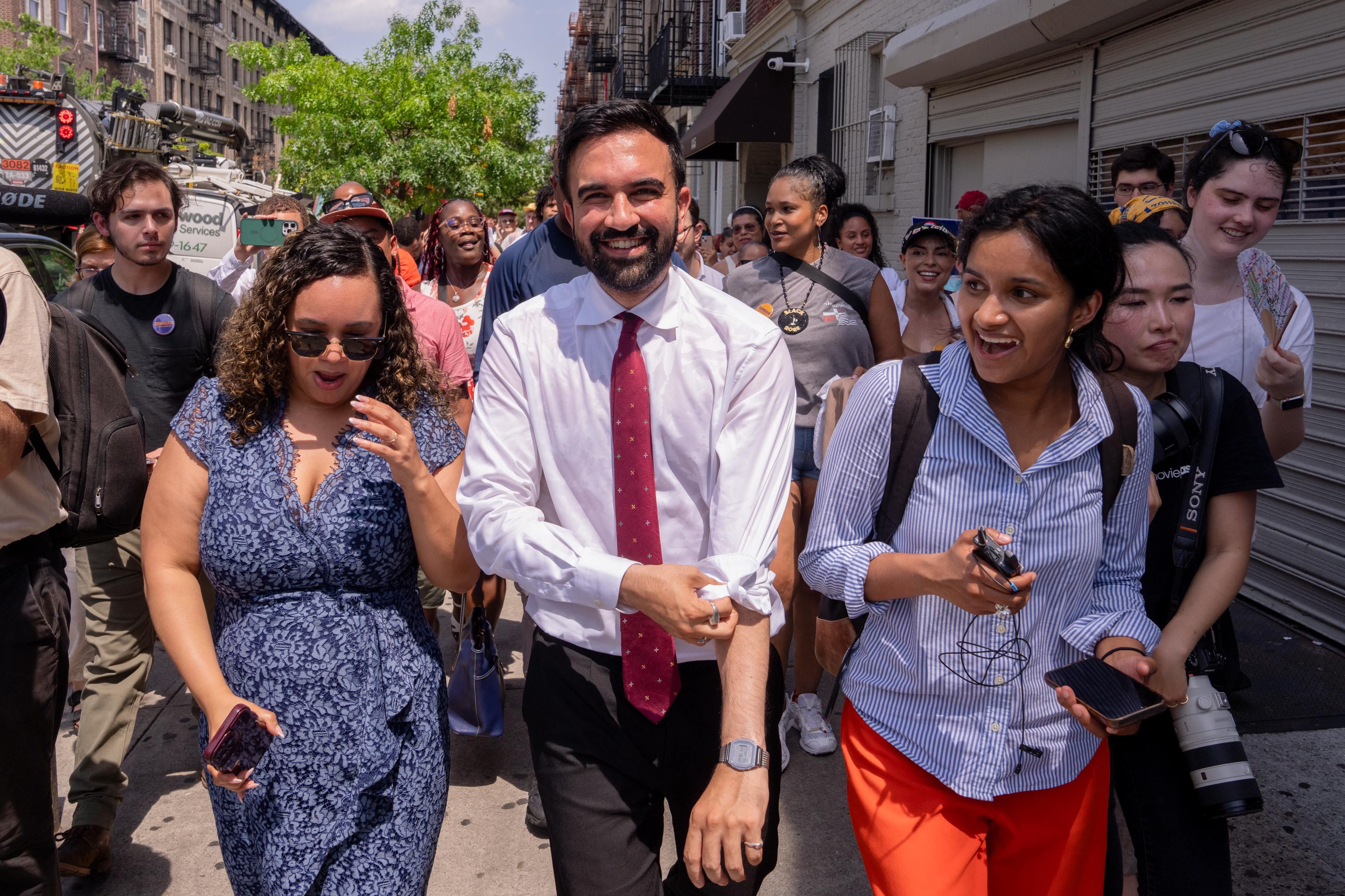 Zohran Mamdani rolls up his sleeves while campaigning in  Manhattan yesterday.