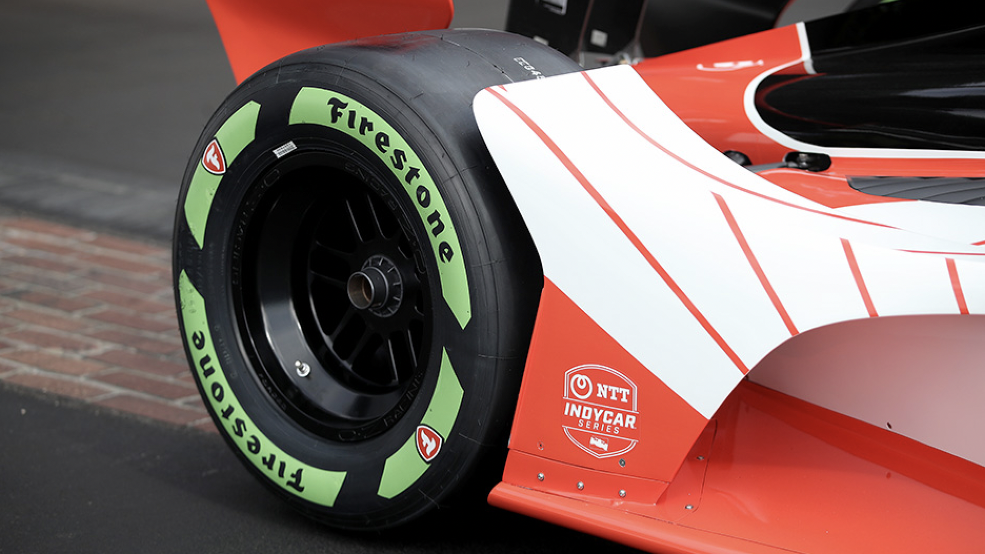 A tire with a bright green wall.