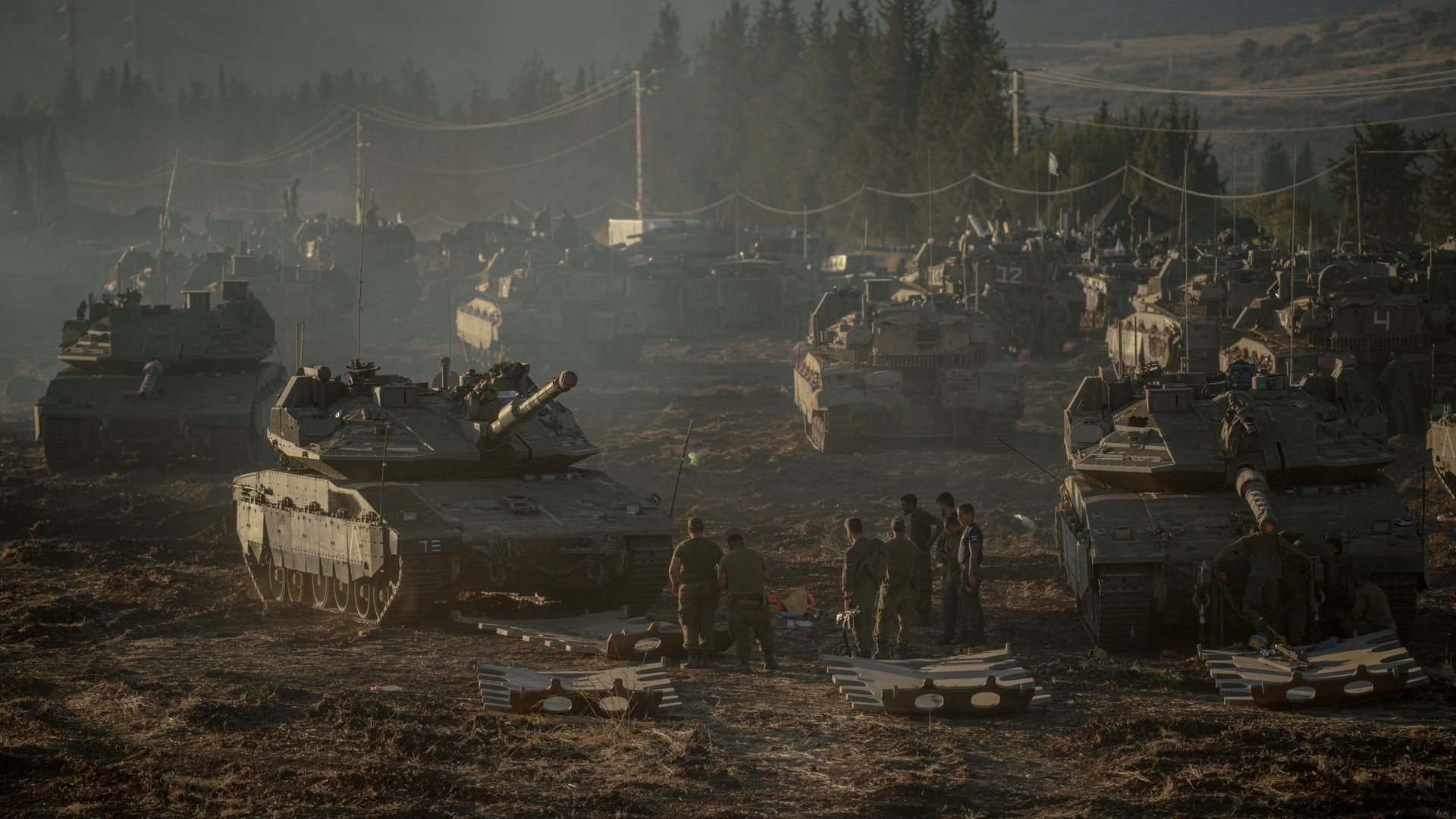 Israeli tanks and APC's gather by the Israeli - Lebanese border on September 30, 2024.
