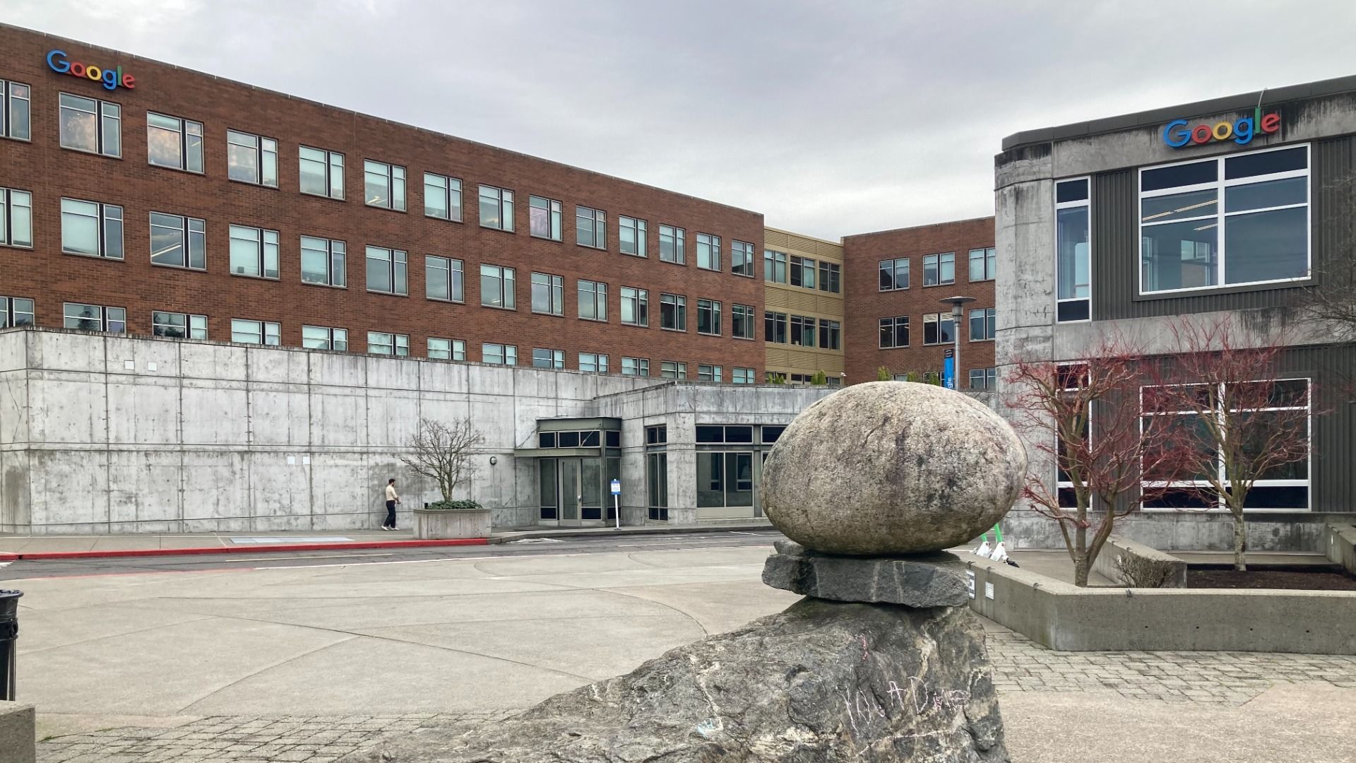 A balanced rock sculpture at a plaza in front of Google buildings in Seattle.