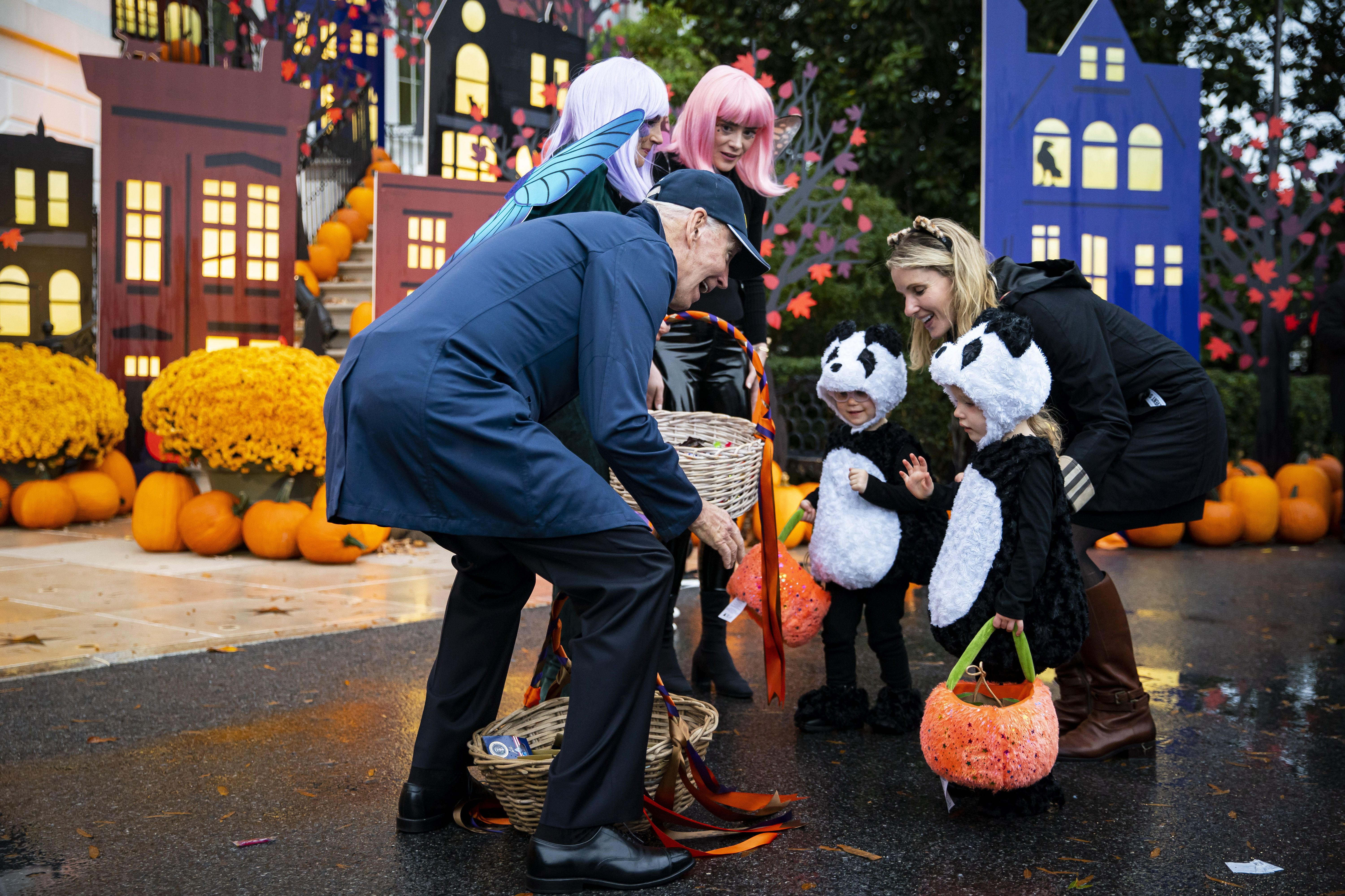Biden greets two kids dressed as pandas