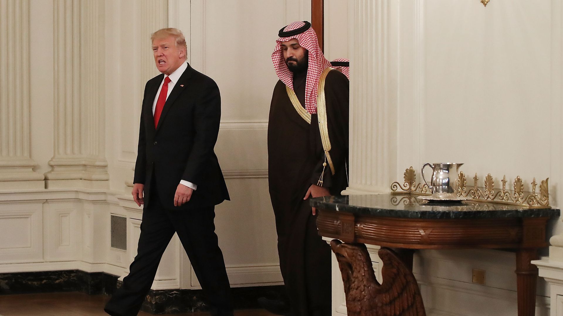 Donald Trump and Mohammed bin Salman walk into the State Dining Room of the White House in March, 2017
