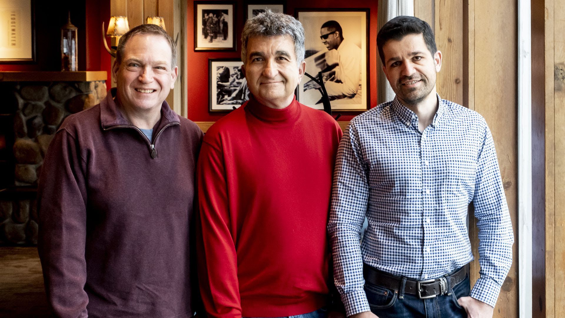 Three people posing for a photo.