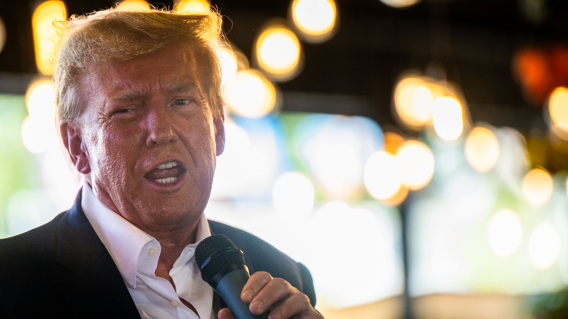 Donald Trump speaks during a rally at the Steer N' Stein bar at the Iowa State Fair on August 12