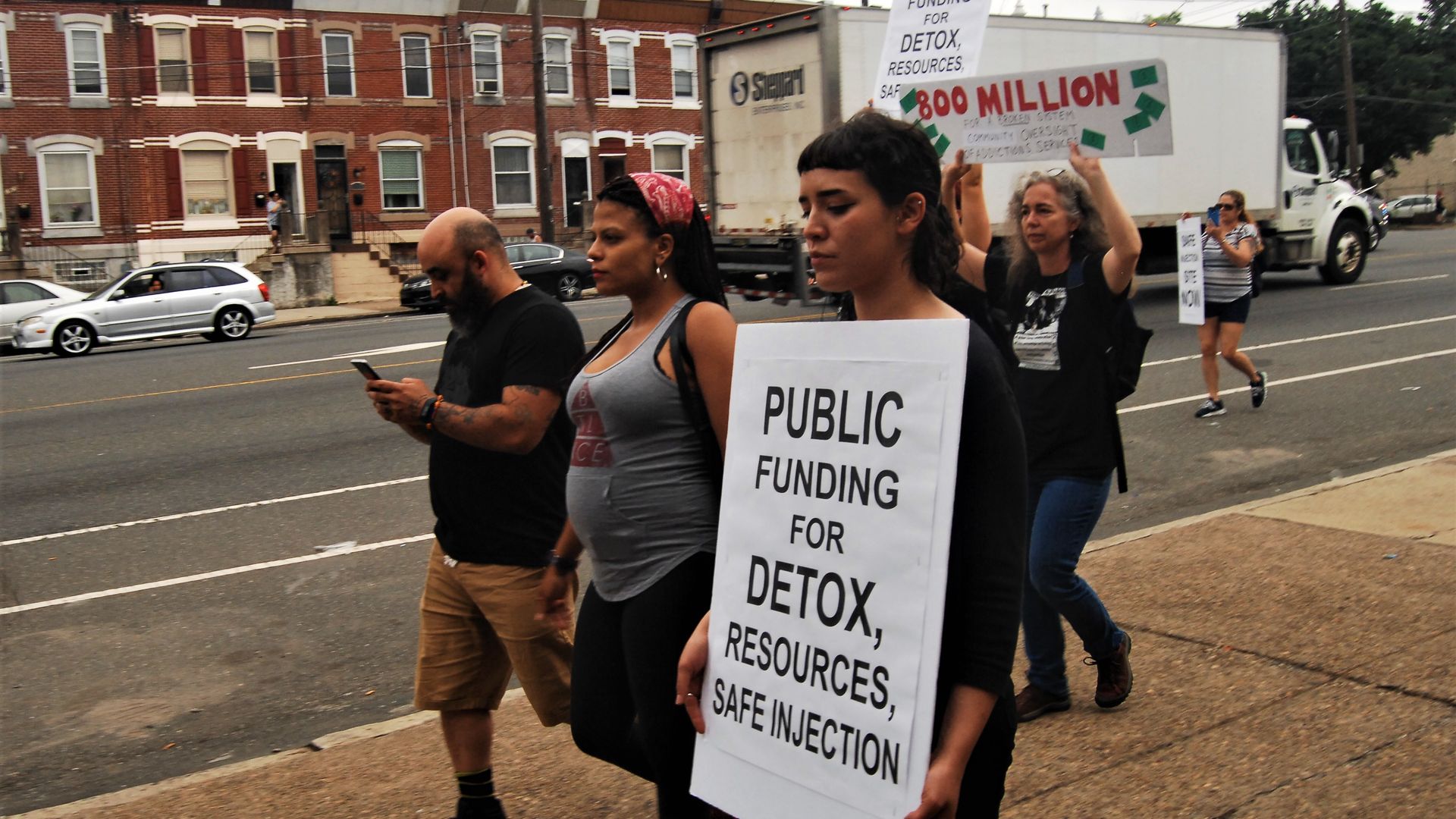 Advocates, activists and homeless folks protest through the streets of Kensington to demand adequate shelter and treatment beds