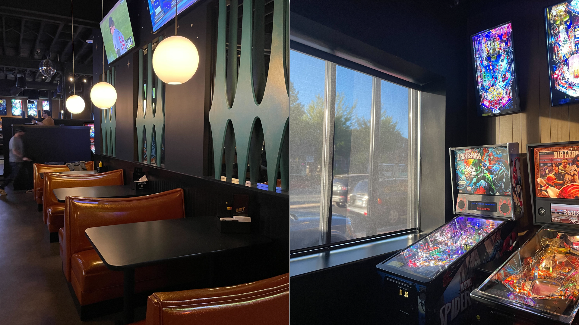 A line of booths against a black and green wall and a photo of two pinball machines next to a window