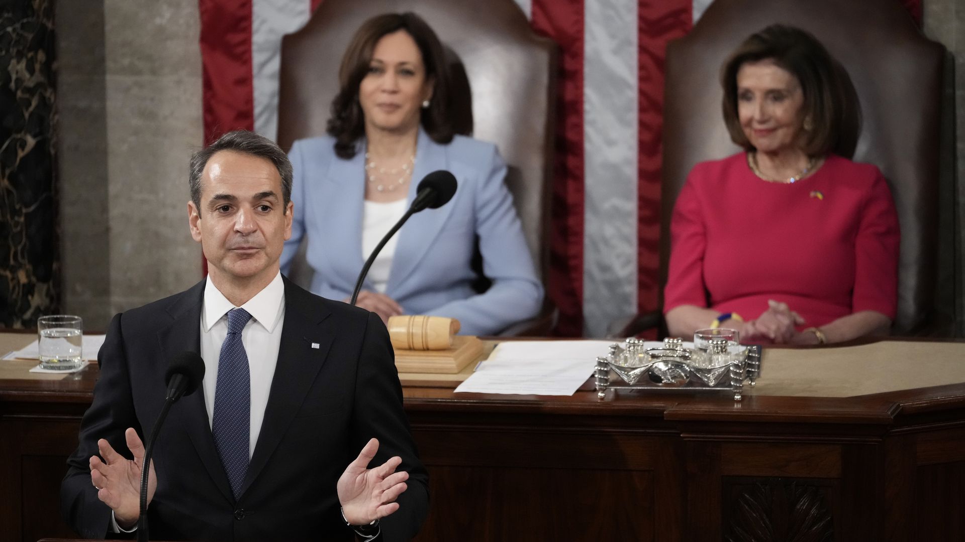 Vice President Kamala Harris and House Speaker Nancy Pelosi are seen listening to Greece's prime minister as he addresses Congress.