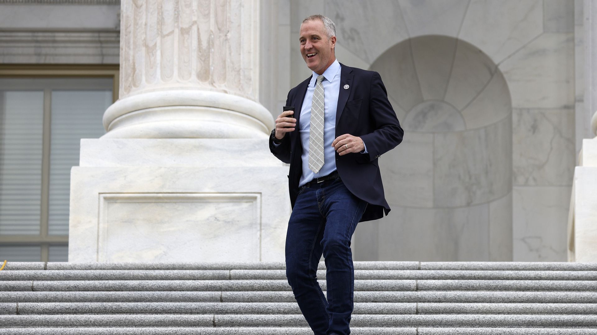 Sean Patrick Maloney walks down stairs