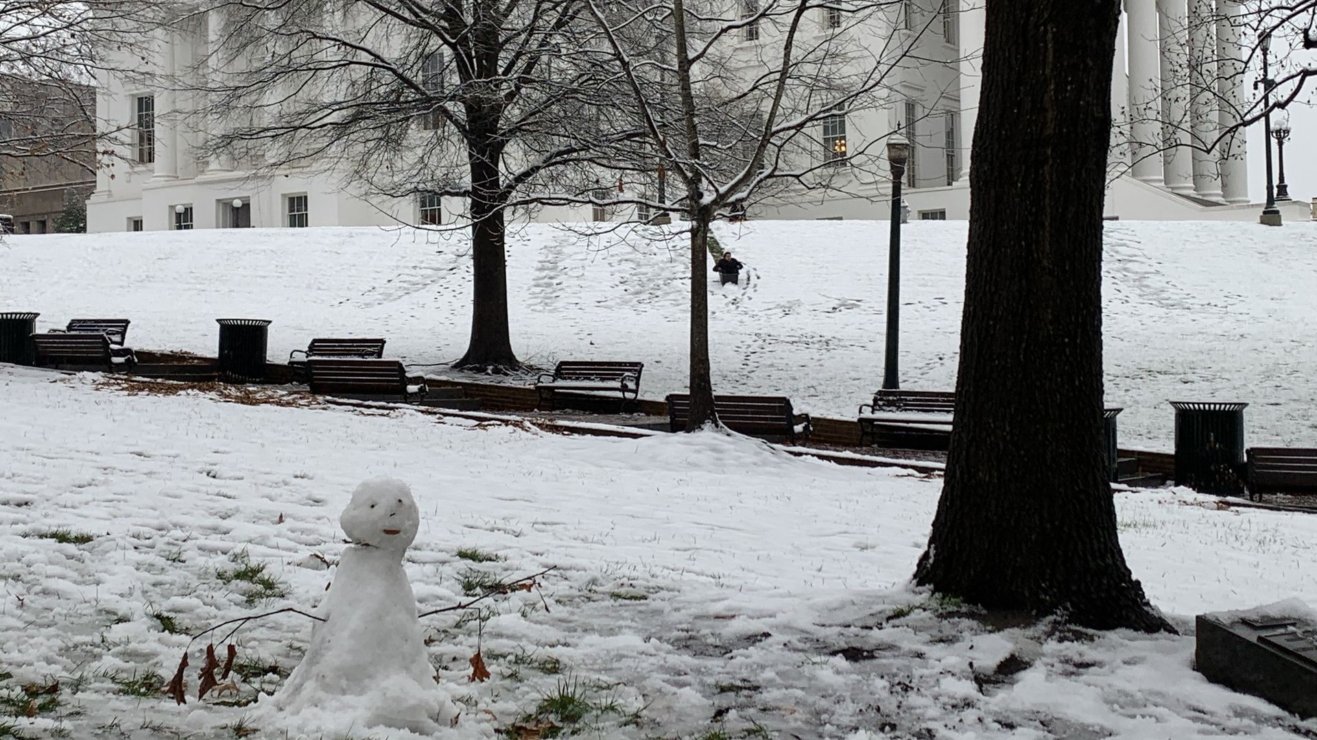 The Virginia State Capitol with a sad looking snowman