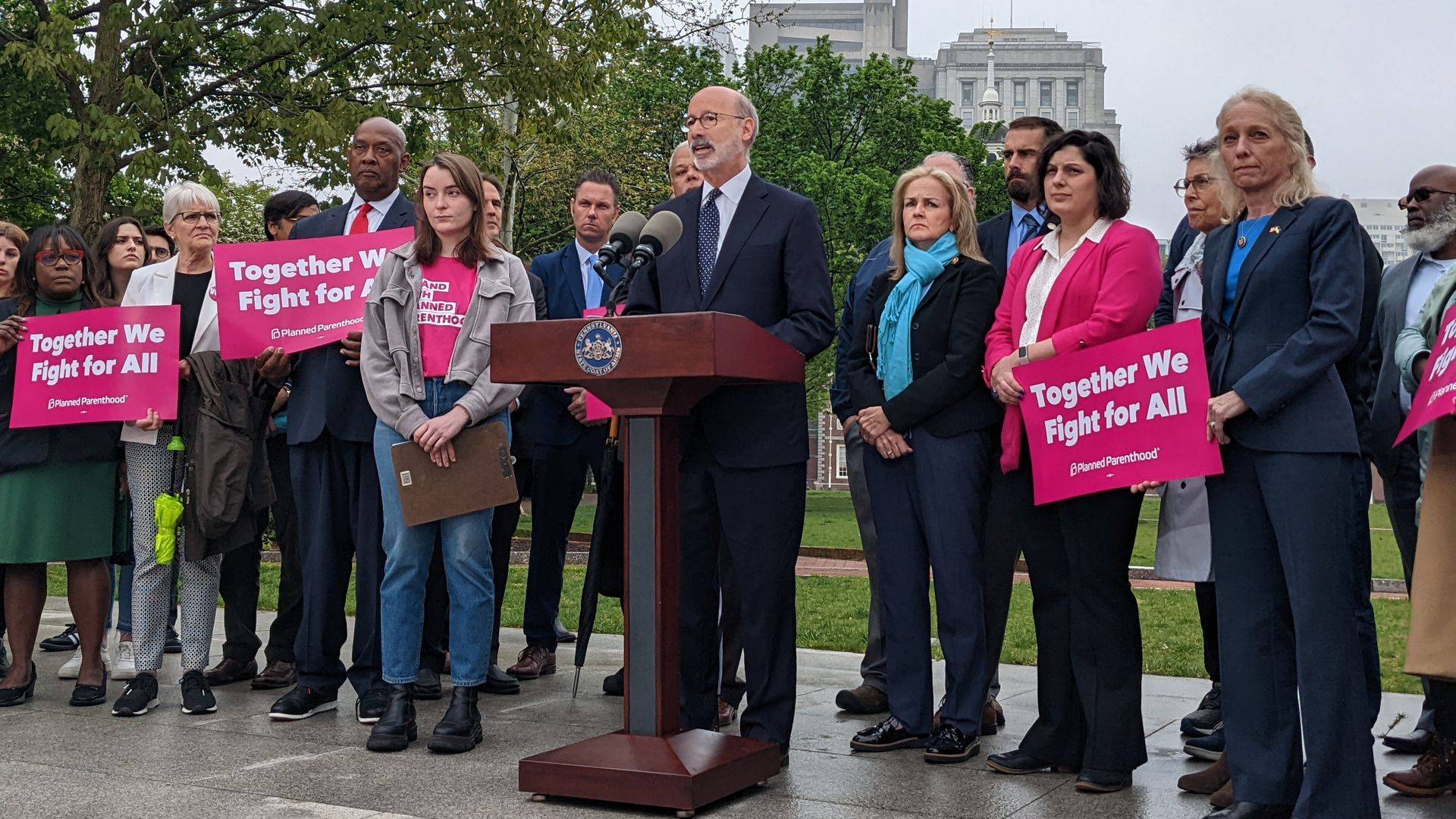 Gov. Tom Wolf is flanked by other Democratic officials and abortion-rights activists.