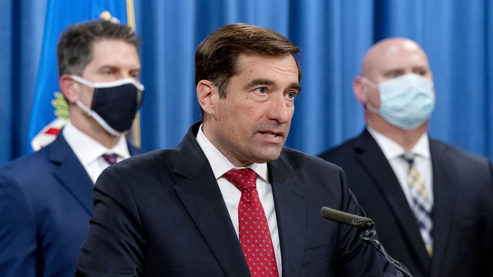 Assistant Attorney General for the National Security Division John Demers speak at a press conference