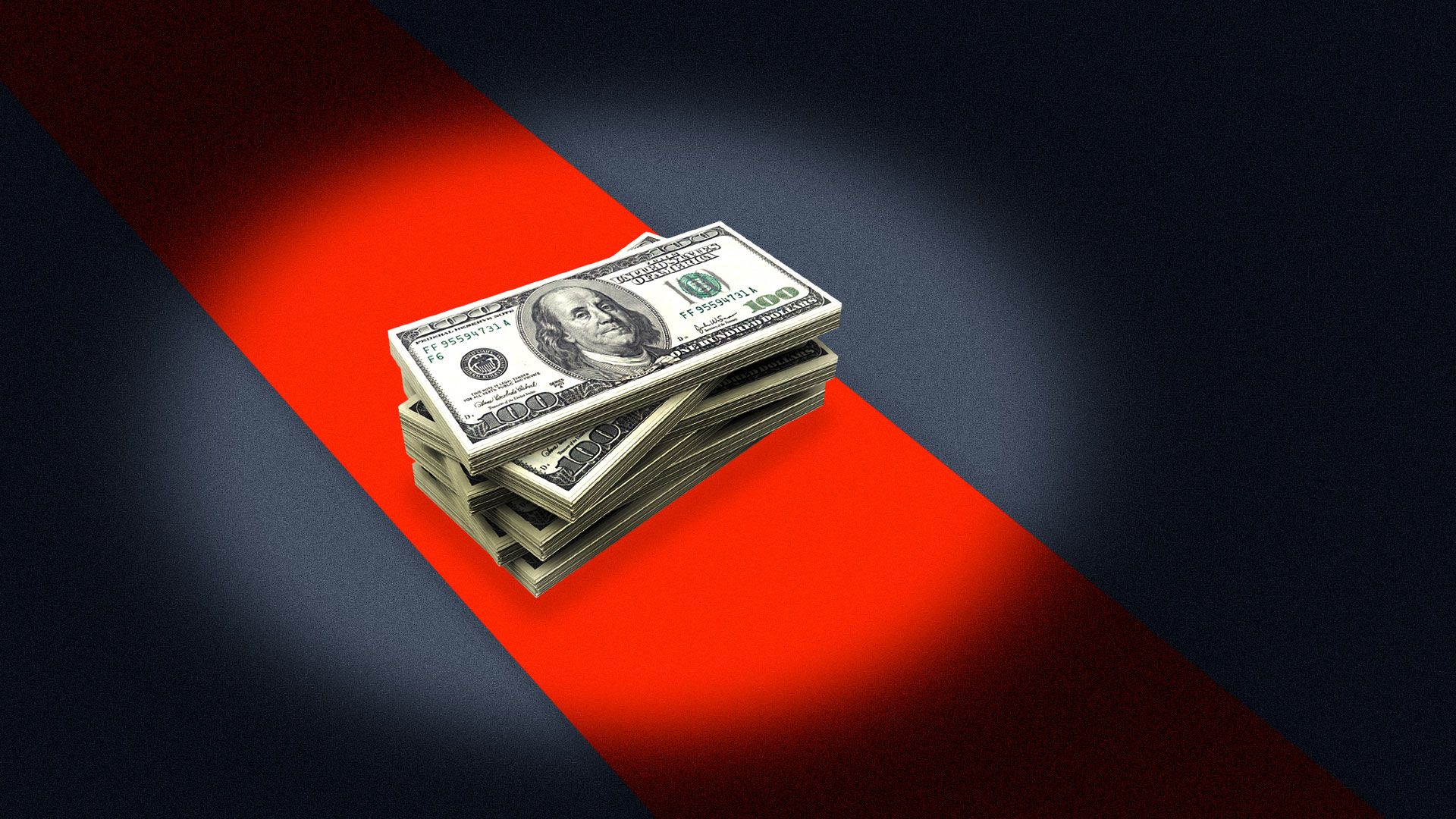 A stack of bills on a red carpet under a spotlight.